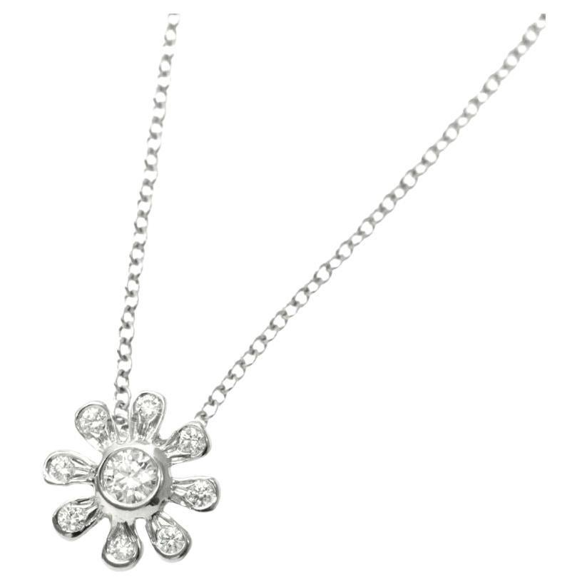 TIFFANY
Co. Paloma Picasso Platinum Diamond Daisy Pendant Necklace