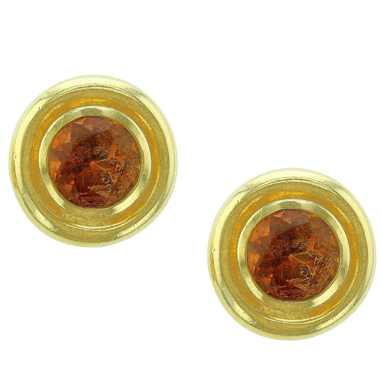 A simple and elegant pair of round citrine earrings in 18K Yellow Gold. Signed 
