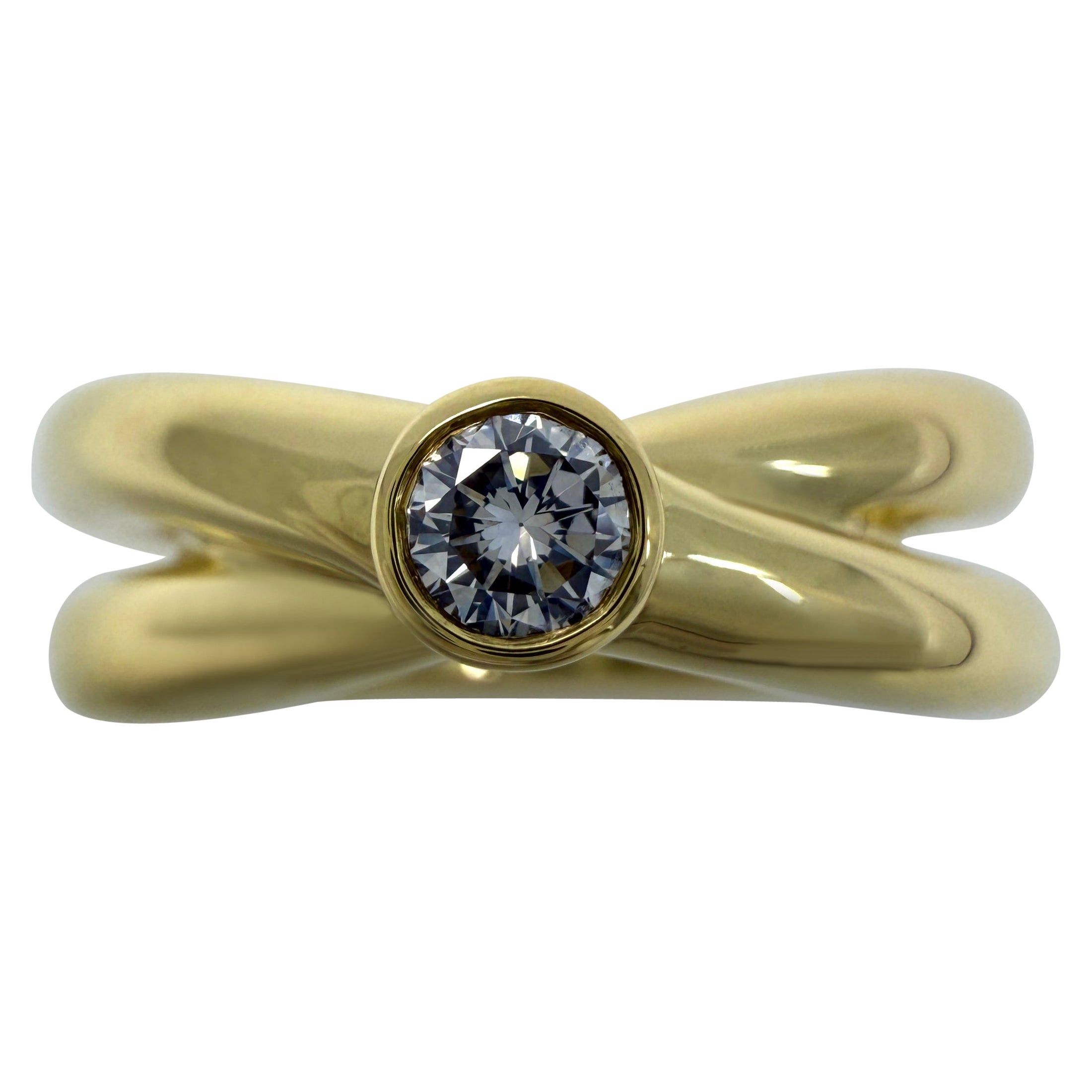 Tiffany & Co. Paloma Picasso Bague à croix croisée en or 18k avec solitaire et diamant rond en vente