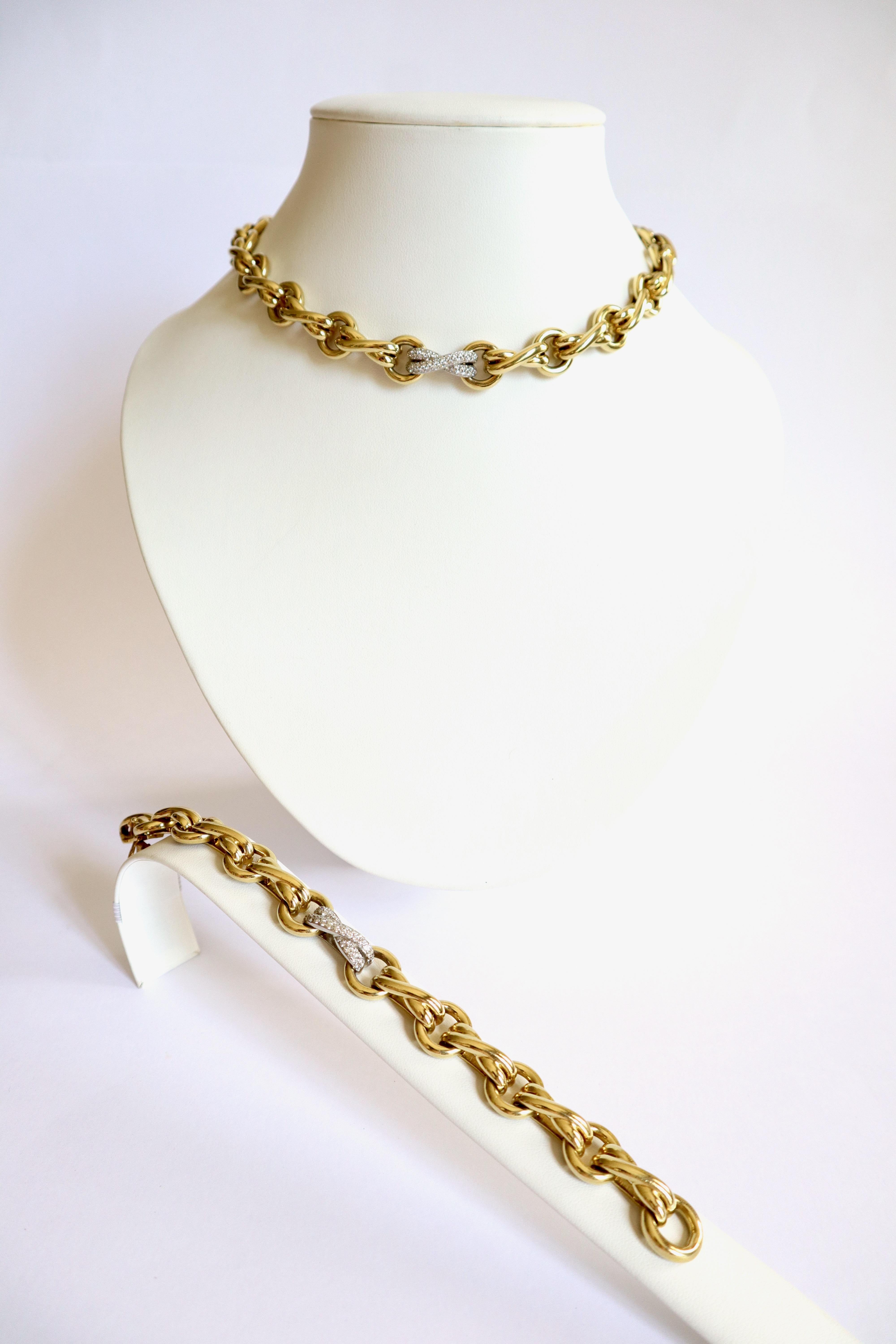 Tiffany's Paloma Picasso Bracelet and Necklace in 18kt Yellow Gold Platinum and Diamonds. Together they can form a long necklace.
Alternate Circles of interlaced double Links. A Platinum Link is paved with Diamonds for about 0.5 to 0.8 Carat on each