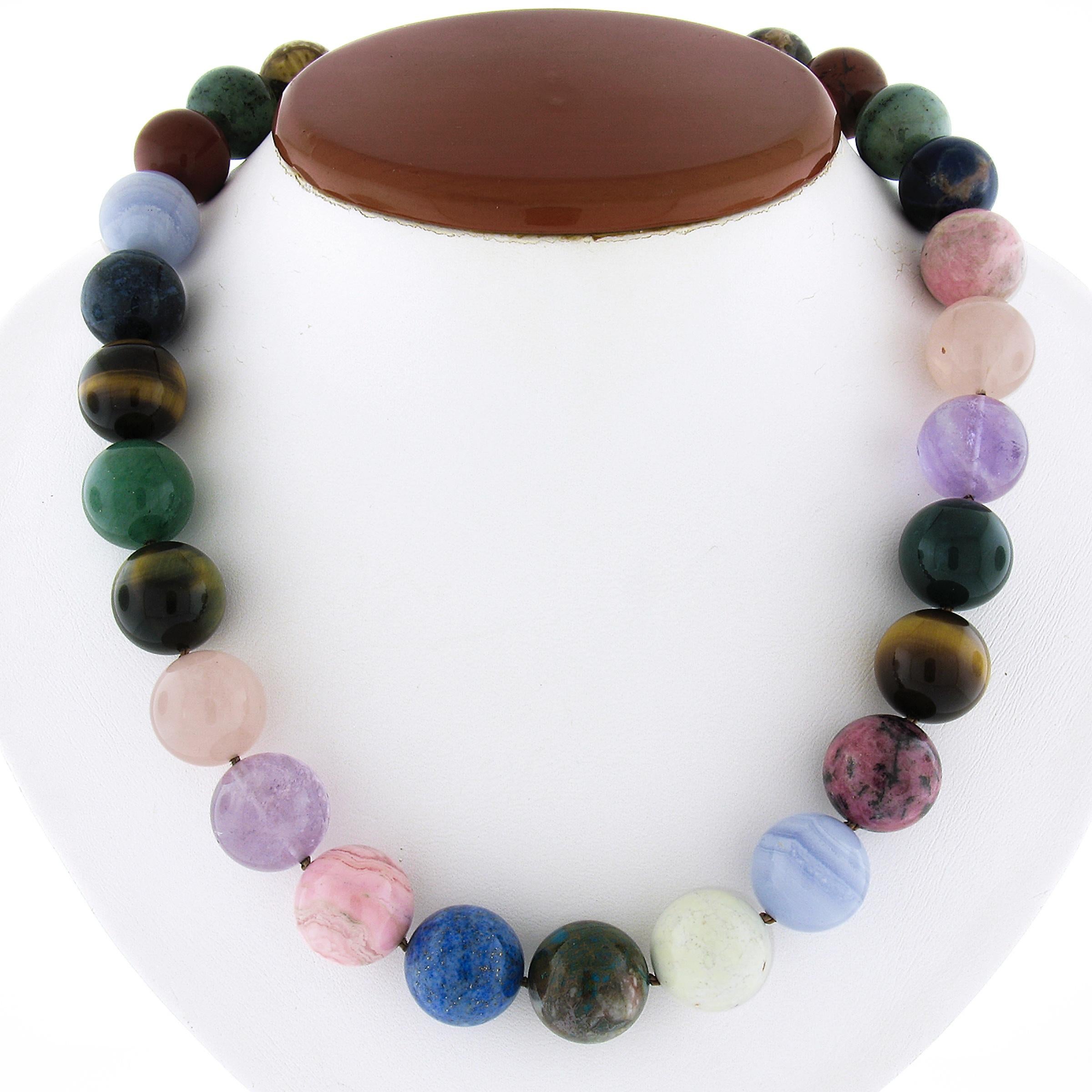 --Stone(s):--
(27) Natural Multi Gemstones - Round Bead Shape - Multiple Colors - 15mm (approx.)

Material: String w/ Solid Sterling Silver Clasp
Weight: 142.6 Grams
Chain Type: Bead Chain
Chain Length:	18.5 Inches
Clasp: Hook Clasp
Stamp: Paloma