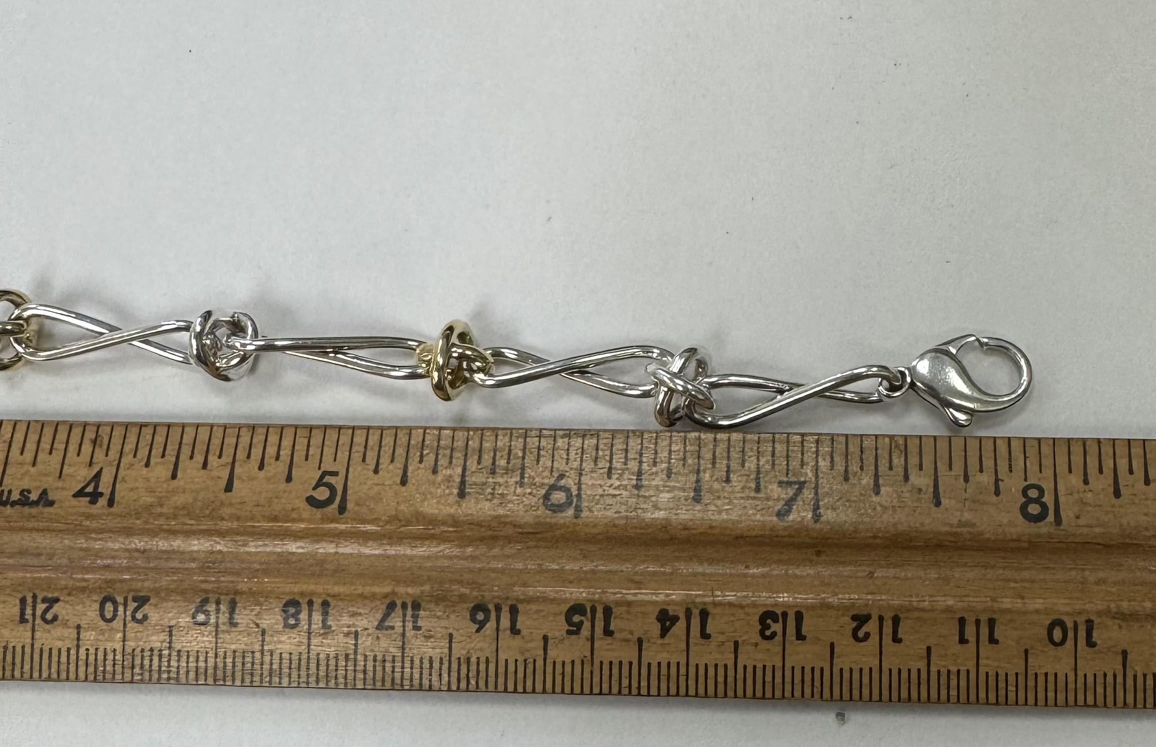 Tiffany Co Paloma Picasso Sterling Silver 18K Yellow Gold Twisted Link Bracelet In Excellent Condition In Los Angeles, CA