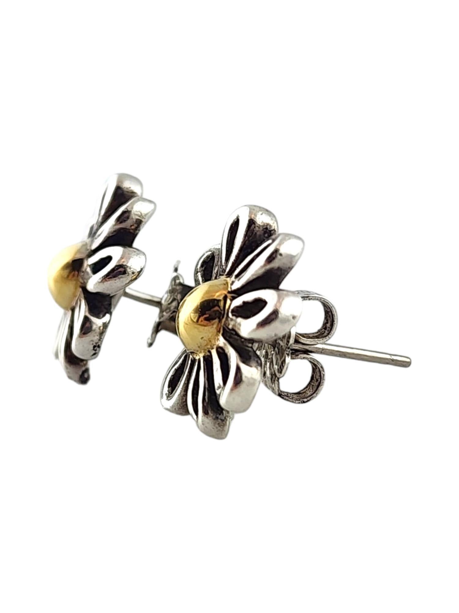 Tiffany & Co Paloma Picasso Sterling Silver Daisy Stud Earrings

This gorgeous set of Paloma Picasso daisy stud earrings by Tiffany & Co were meticulously crafted from sterling silver with a gold color center.

Size: 13.04mm X 13.75mm X