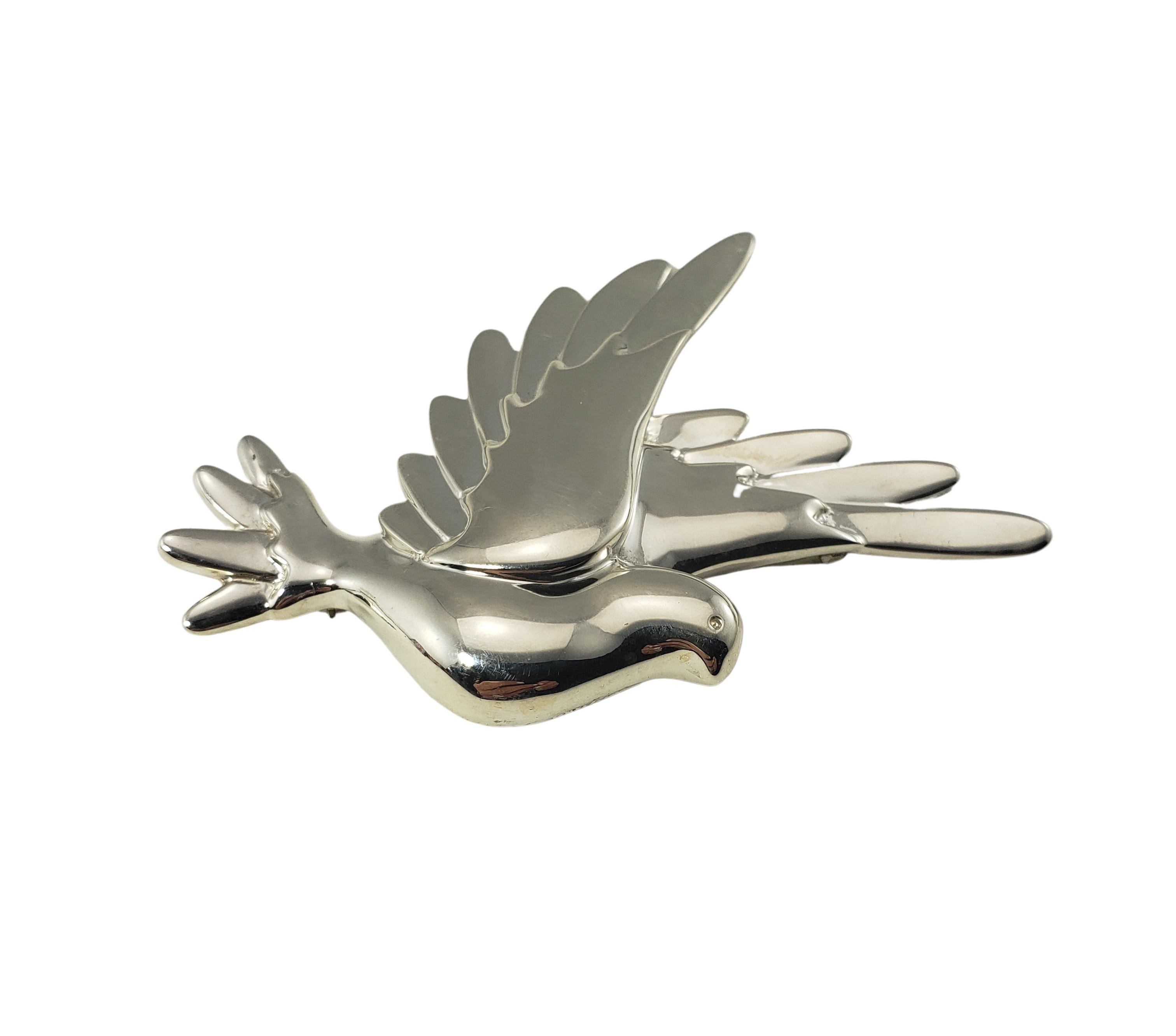 Tiffany & Co. Paloma Picasso Sterling Silver Dove Brooch/Pin-

This stunning brooch features a beautifully detailed dove crafted in sterling silver by Paloma Picasso for Tiffany & Co.

Size: 3 inches x 2  1/2 inches 

Weight:  17.1 dwt. /  26.7