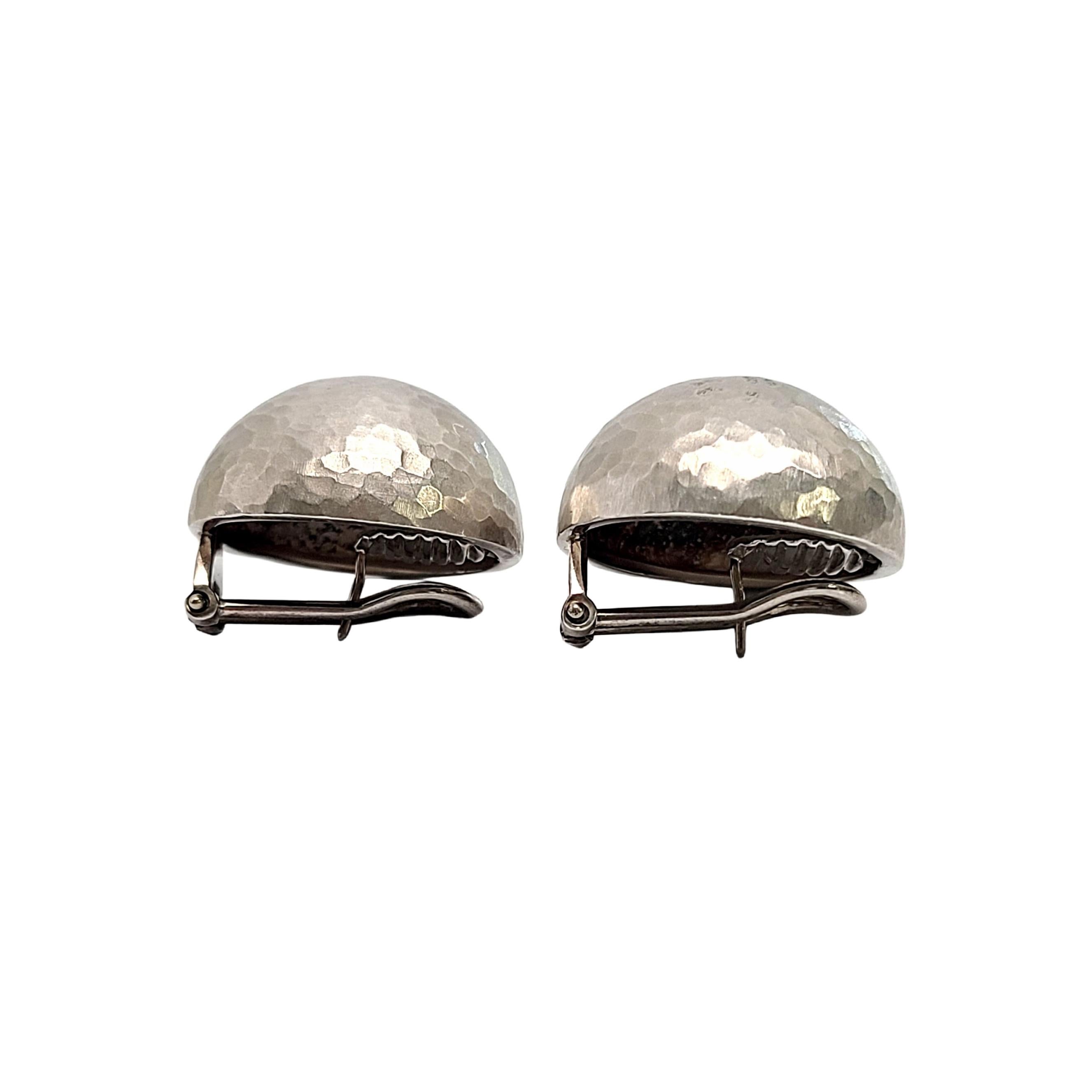 Tiffany & Co sterling silver hammered dome earrings by Paloma Picasso for Tiffany & Co.

Authentic Tiffany earrings featuring classic hammered design on large dome earrings with an omega back. Tiffany box and pouch are not included.

Measures approx