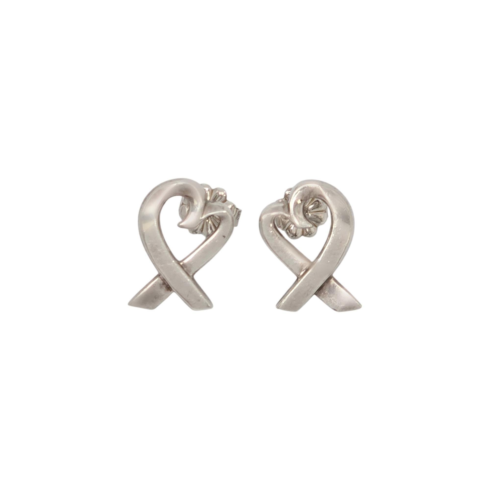 Loving Hearts-Ohrringe aus Sterlingsilber von Paloma Picasso für Tiffany & Co.

Diese kultigen Loving Hearts-Ohrringe sind ein Originaldesign von Paloma Picasso, schlicht und klassisch. Das Tiffany-Etui und die Schachtel sind nicht enthalten.

Maße: