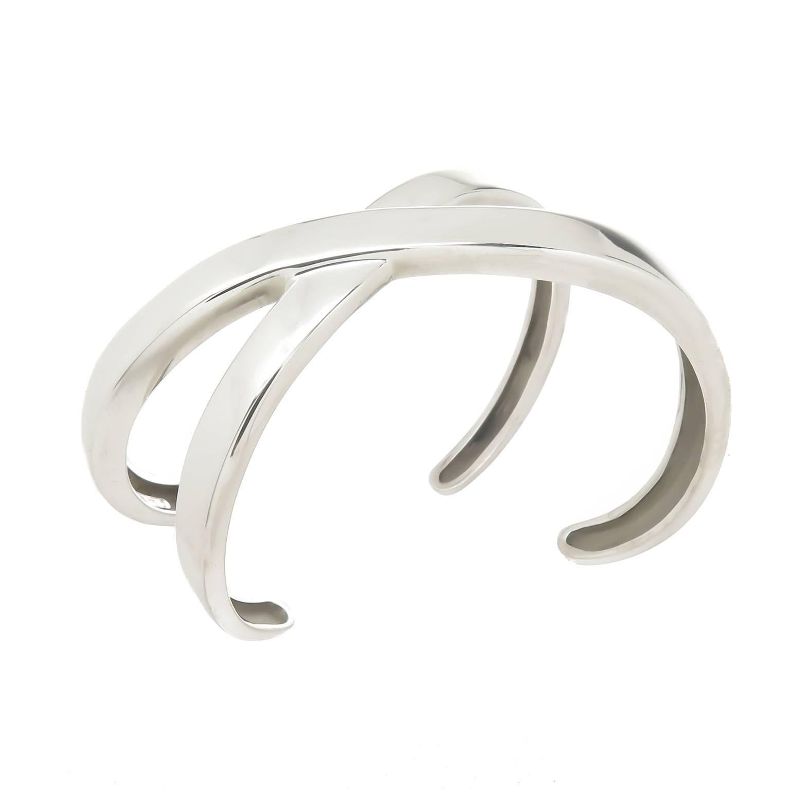 Circa 1990 Paloma Picasso for Tiffany & Company Sterling Silver X cuff bracelet, measuring 1 1/4 inch wide with an opening of 1 1/4 inch and an inside measurement of approximately 5 inch. 