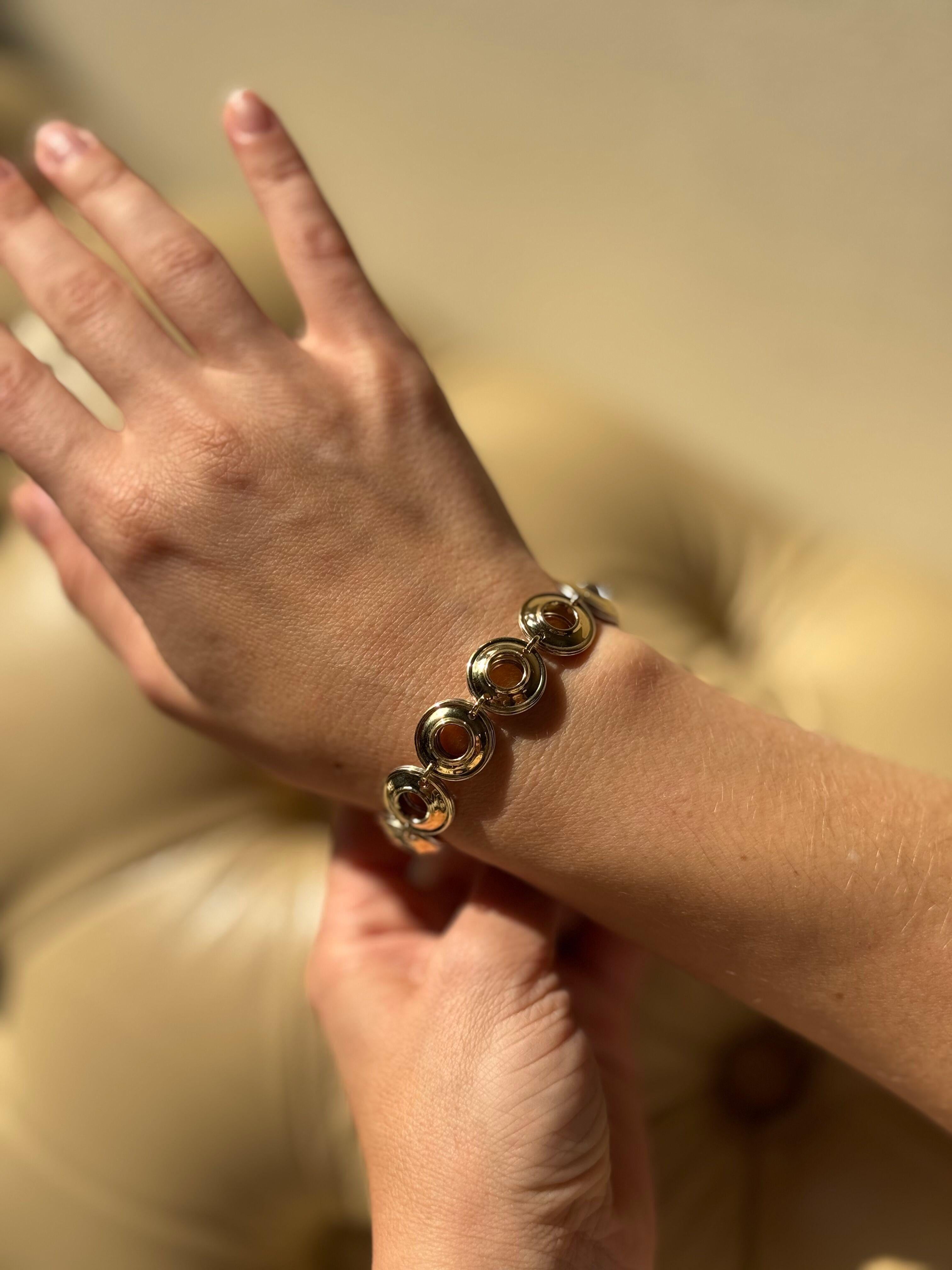 Bracelet vintage à maillons circulaires réversibles, serti d'or jaune 18k et d'argent sterling par Paloma Picasso, pour Tiffany & Co.

Le bracelet est long de 7,5