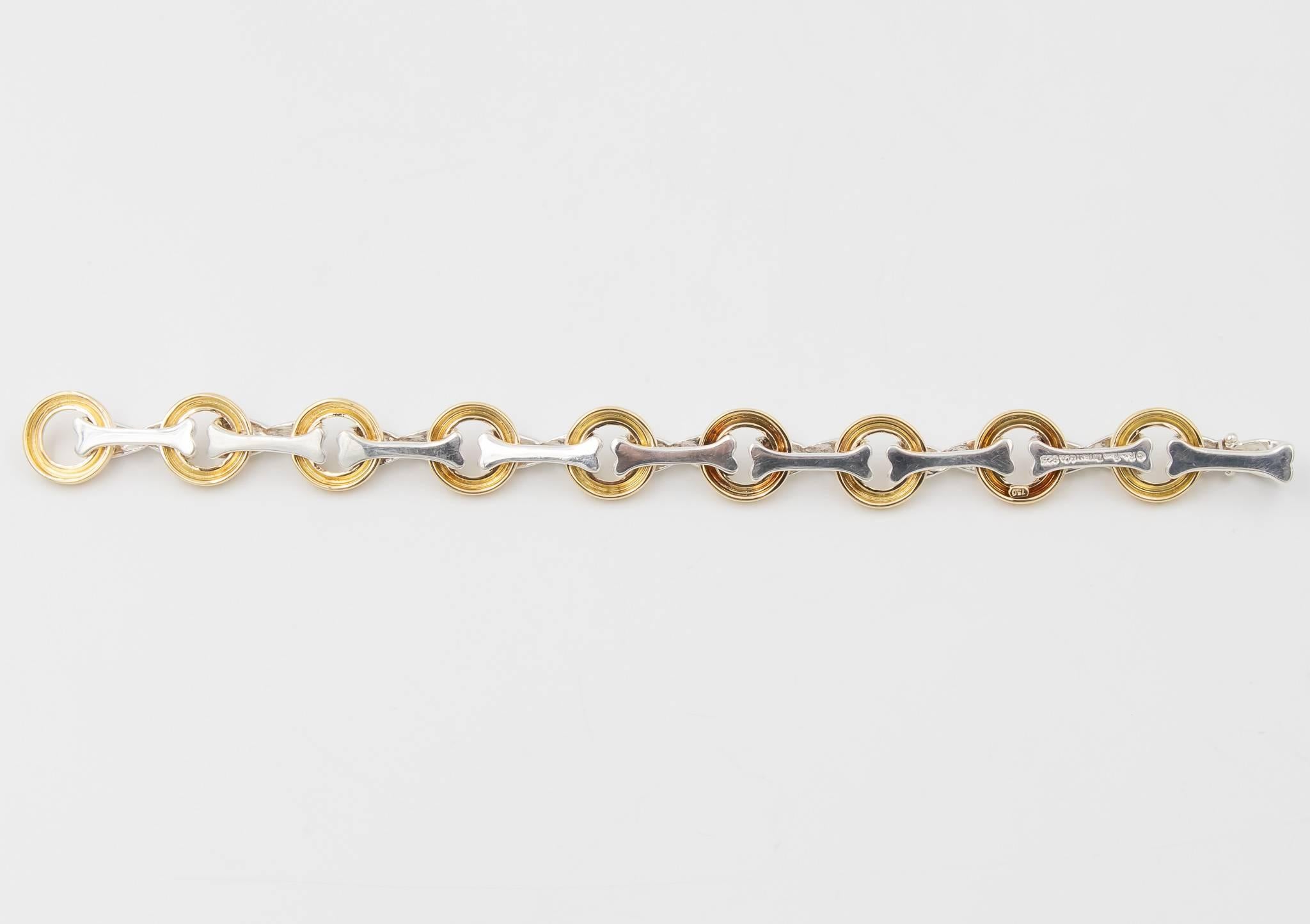 This Tiffany & Co. Paloma Picasso bracelet was recently traded in to our store and is beautiful.  The bracelet has the X design in the silver linked to the O design in 18k yellow gold.  The bracelet clasps with a locking hinge clasp from one of the