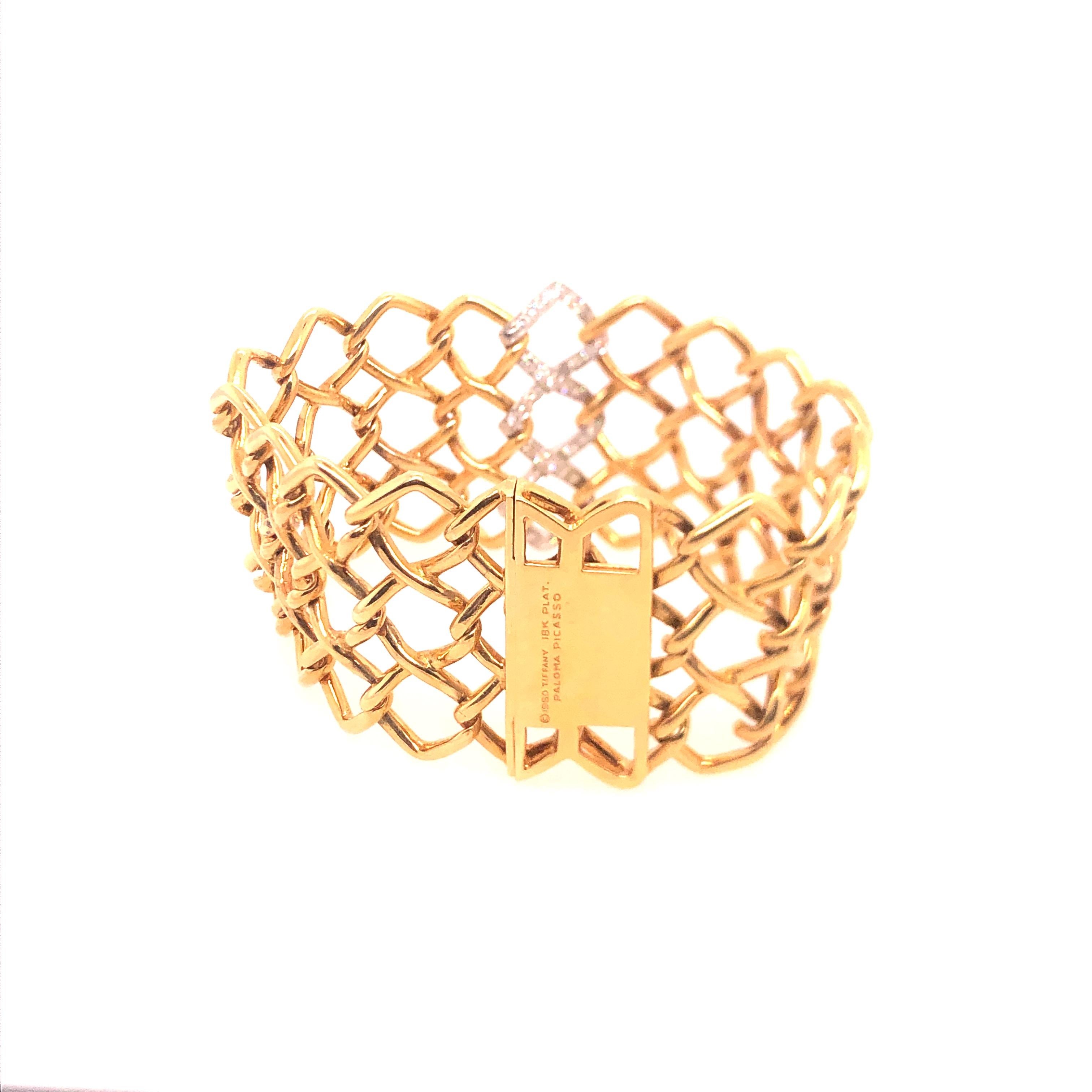 If you are looking for an unique and fetching piece, this yellow gold, platinum, and diamond bracelet designed by Paloma Picasso for Tiffany & Co. is for you. 
It features three rows of diamond-shaped links with the vertical center links in platinum