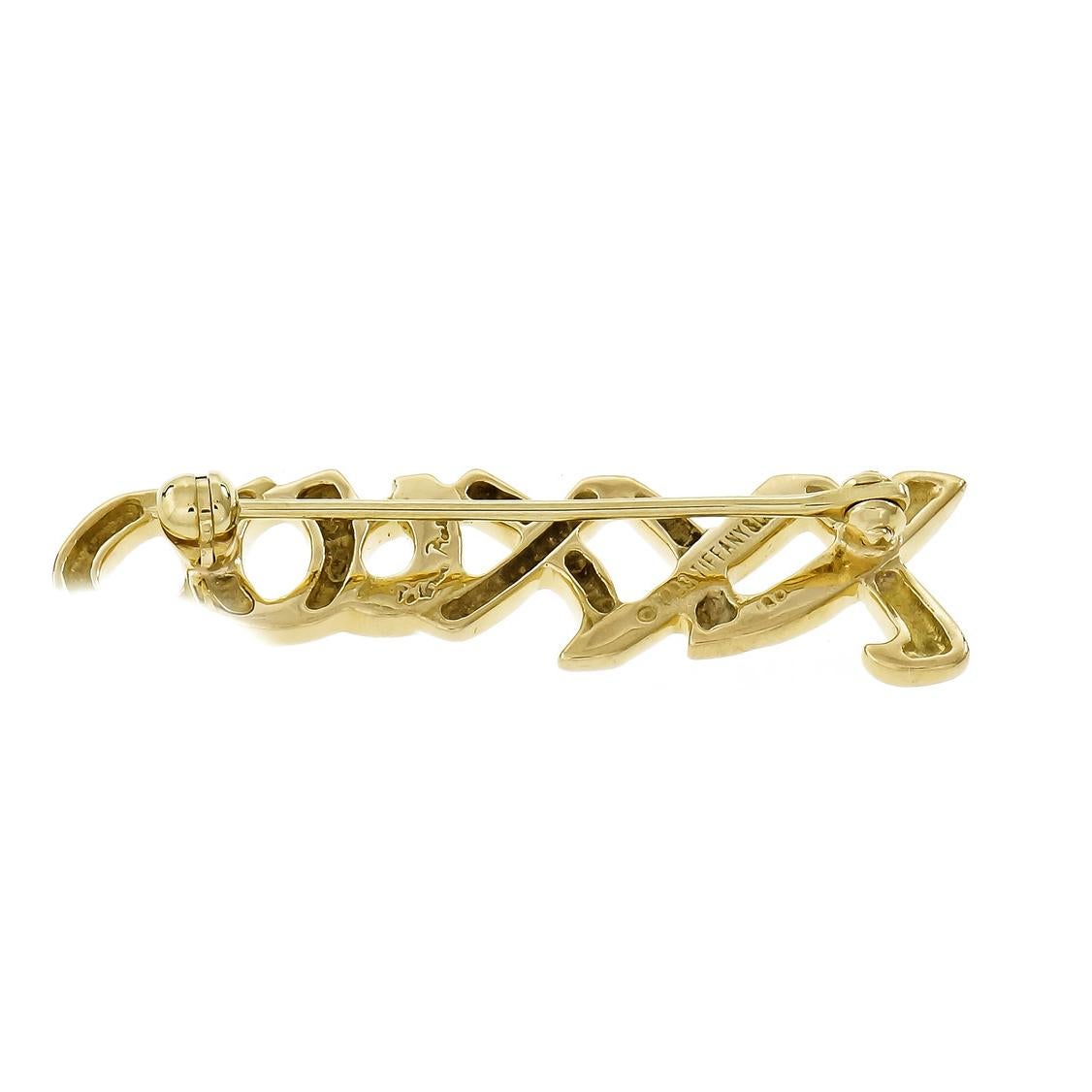 Tiffany & Co Paloma Picasso signature “XO” 18k yellow gold brooch.

18k yellow gold
Tested: 18k
Hallmark: Paloma Picasso Tiffany & Co © 1993
5.0 grams
Top to bottom: 10.25mm or .40 inch
Width: 36.04mm or 1.42 inches
Depth: 2.04mm

