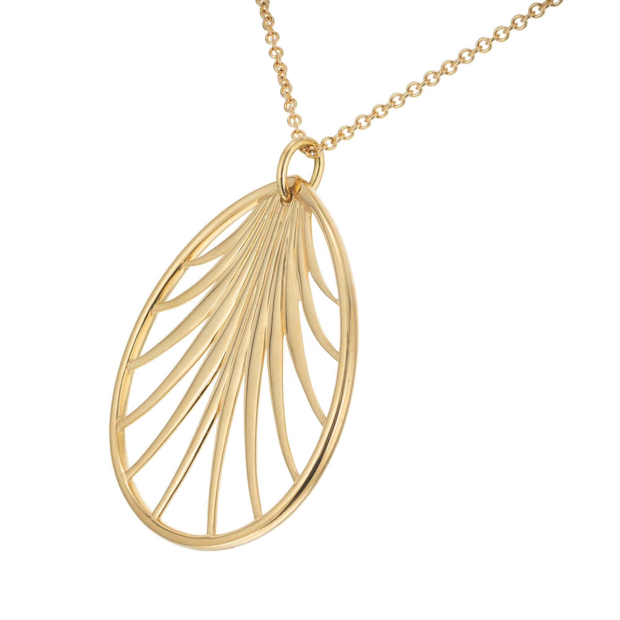 Paloma Picasso palm tree leaf pendant necklace. 18k yellow gold with a 30 Inch chain. Signed T + Co Paloma Picasso. Includes Tiffany box and pouch.

18k yellow gold 
Stamped: 750
Hallmark: T + Co Paloma Picasso 
14.8 grams
Top to bottom: 39.2mm or
