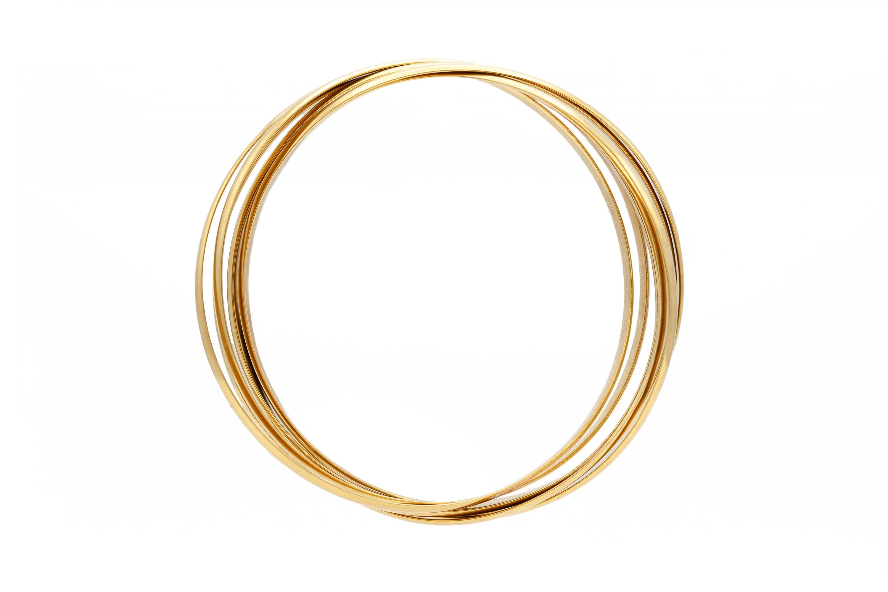 Finely crafted in 18k yellow gold.
7 rolling Bangles
Signed by Tiffany & Co. and Paloma Picasso.
Size 8 inches
Each bangle is 4mm wide.
