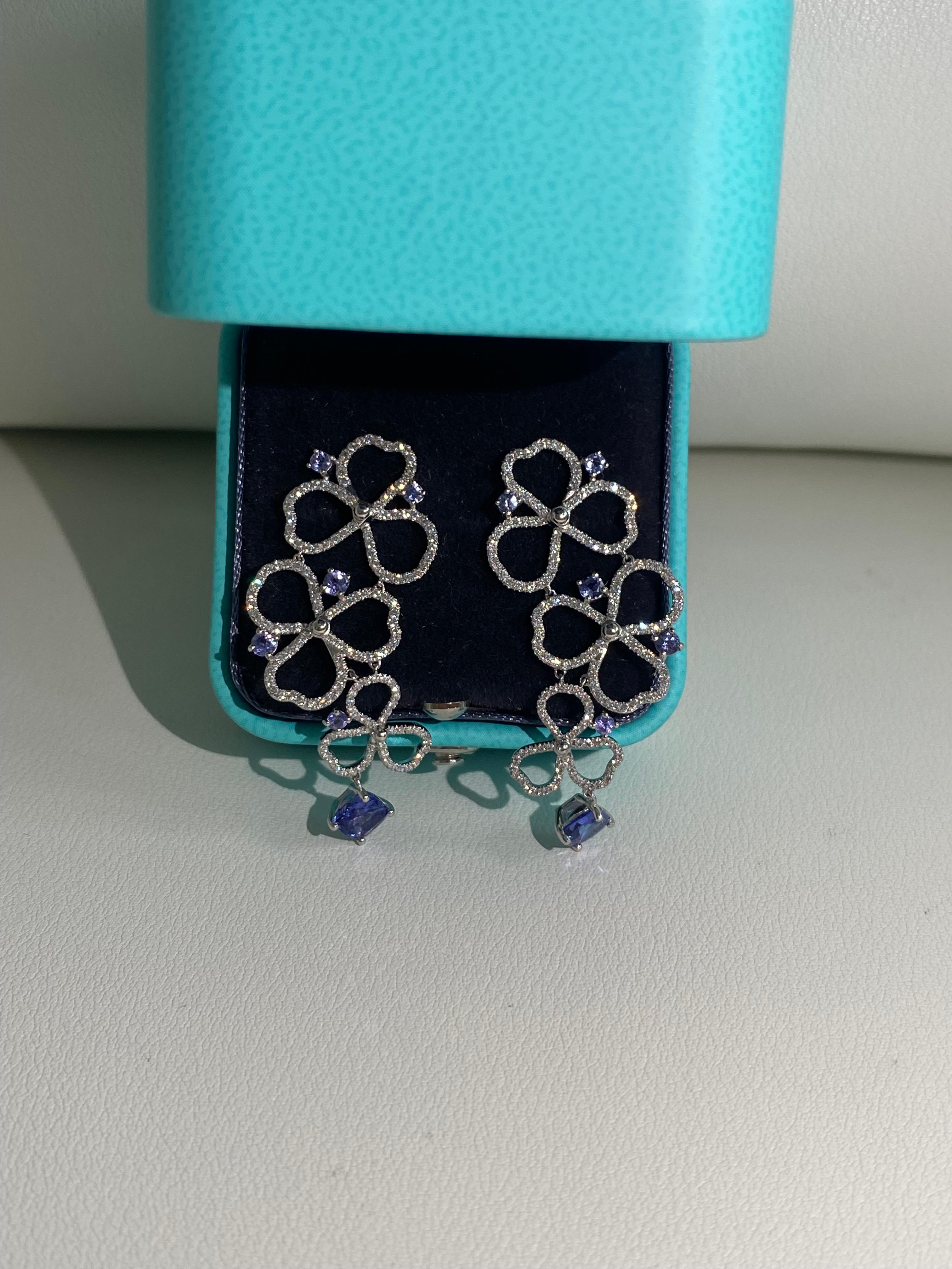 Tiffany CO Paper flower drop earrings with tanzanites and diamonds 
made in platinum 
3 open dangling flowers 
Diamonds : approx. 0.56 ctw
Tanzanites: approx. 1.68 ctw.
Length: 41 mm
Width: 20 mm
Weight: approx. 10.60 grams
La Pousette
