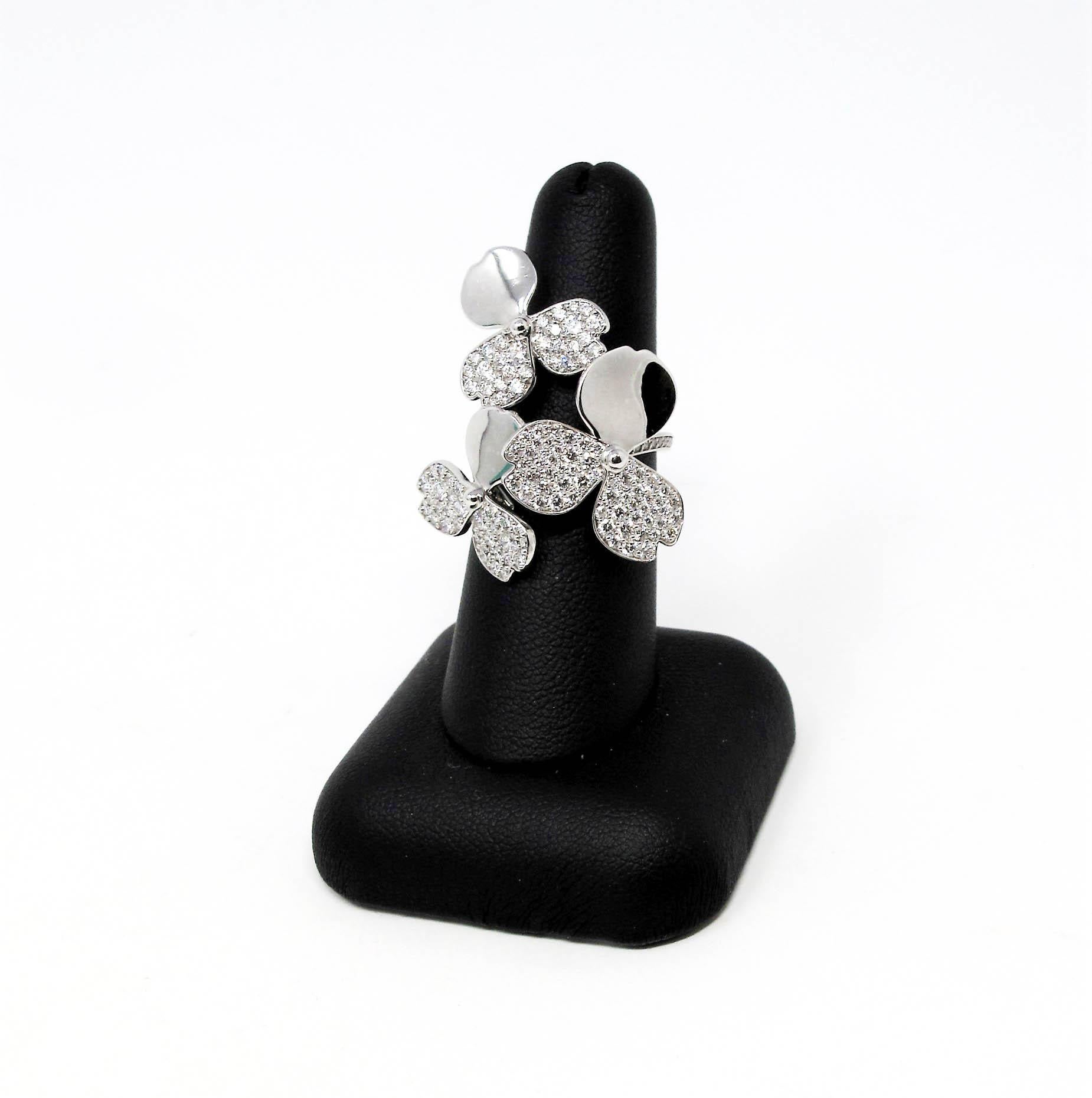 Ring Size: 7

Tiffany & Co. wows us once again with this absolutely incredible diamond cluster ring from the Tiffany & Co. 'Paper Flowers' collection. Substantial in both size and sparkle, this ring exudes modern femininity. 
 
This stunning ring is