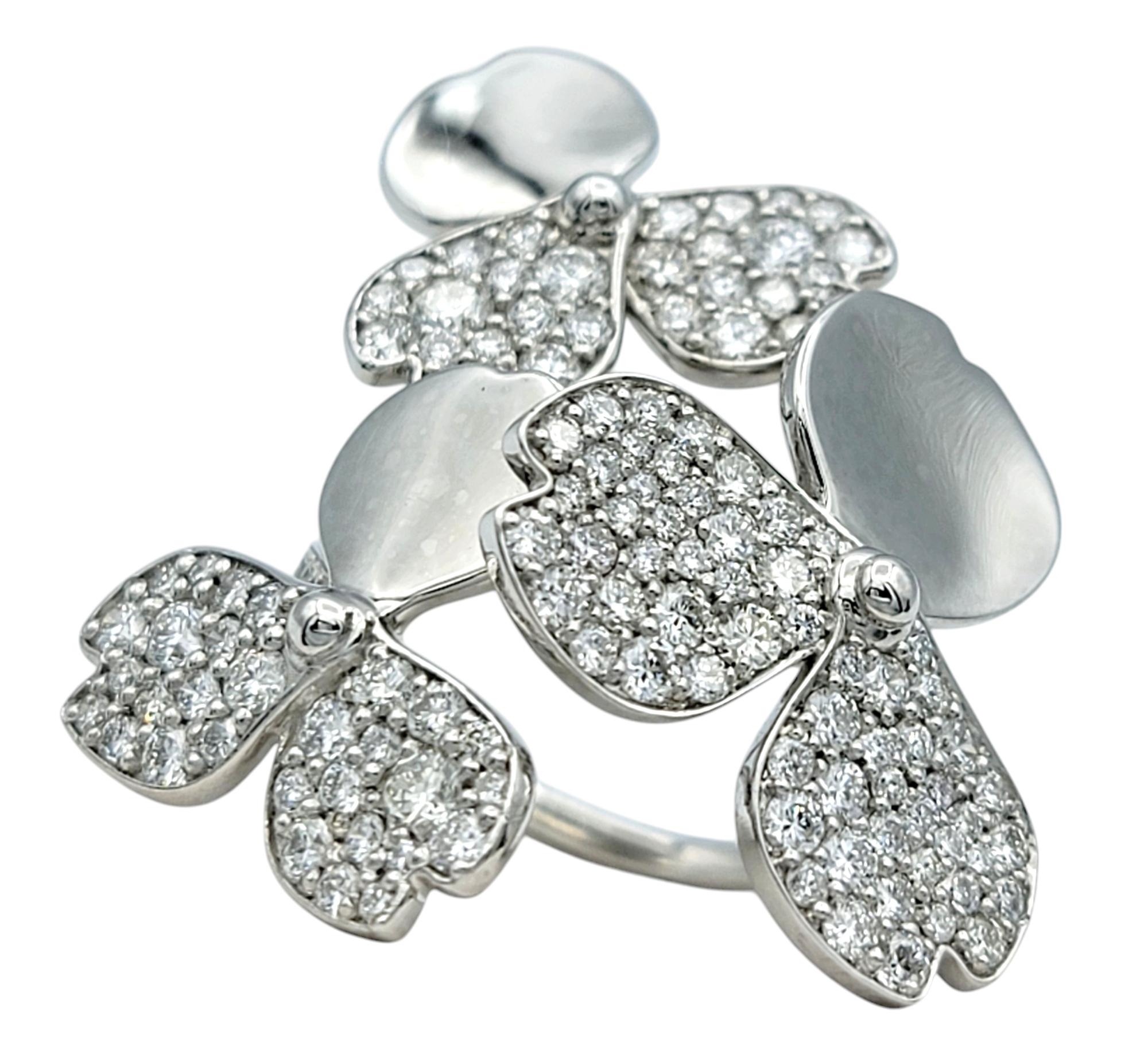 Ring Size: 7

Tiffany & Co. wows us once again with this absolutely incredible diamond cluster ring from the Tiffany & Co. 'Paper Flowers' collection. Substantial in both size and sparkle, this ring exudes modern femininity. 
 
This stunning ring is
