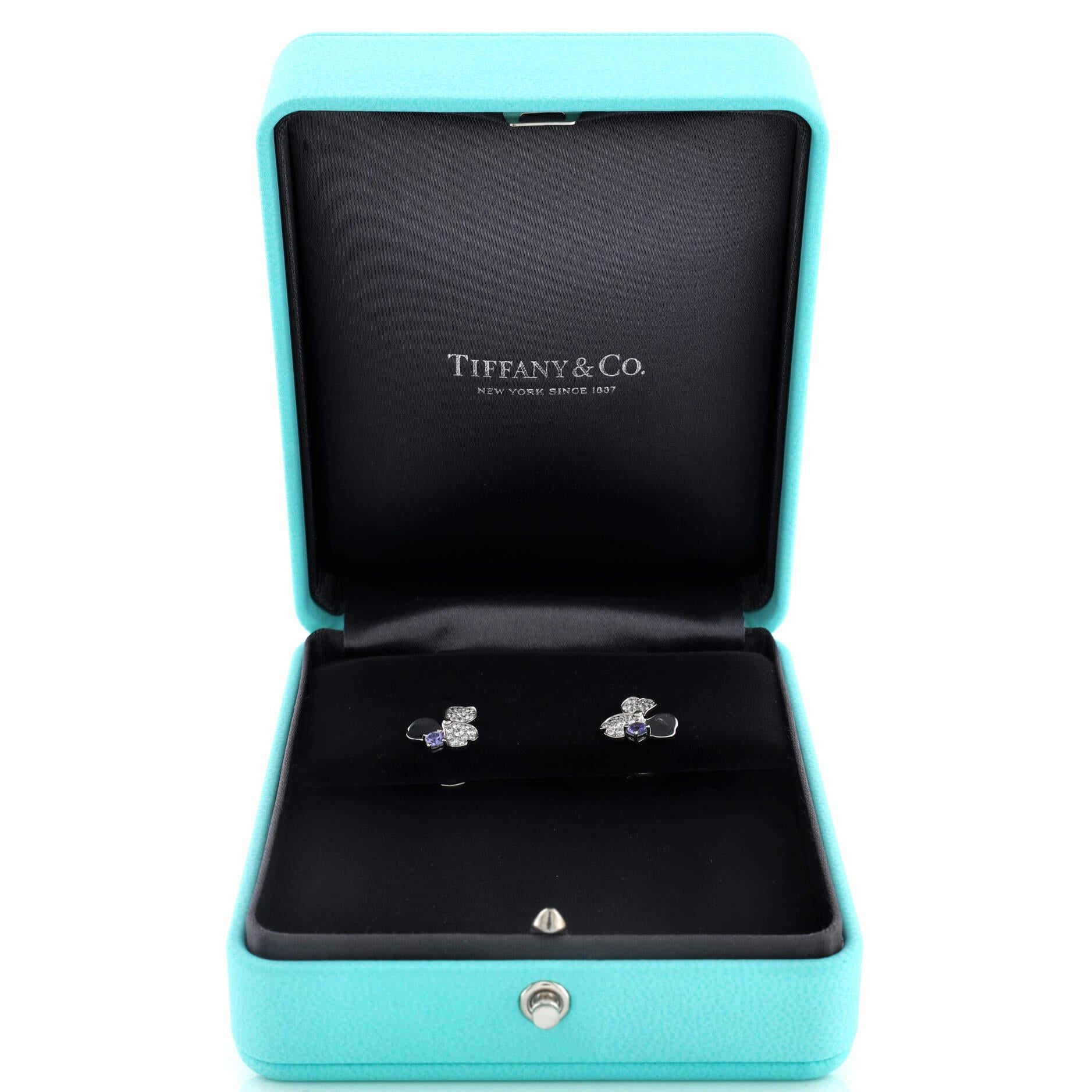Condition: Excellent. Faint wear throughout.
Accessories: No Accessories
Measurements: Height/Length: 11.65 mm, Width: 11.50 mm
Designer: Tiffany & Co.
Model: Paper Flowers Stud Earrings Platinum with Diamonds and Tanzanites
Exterior Color: