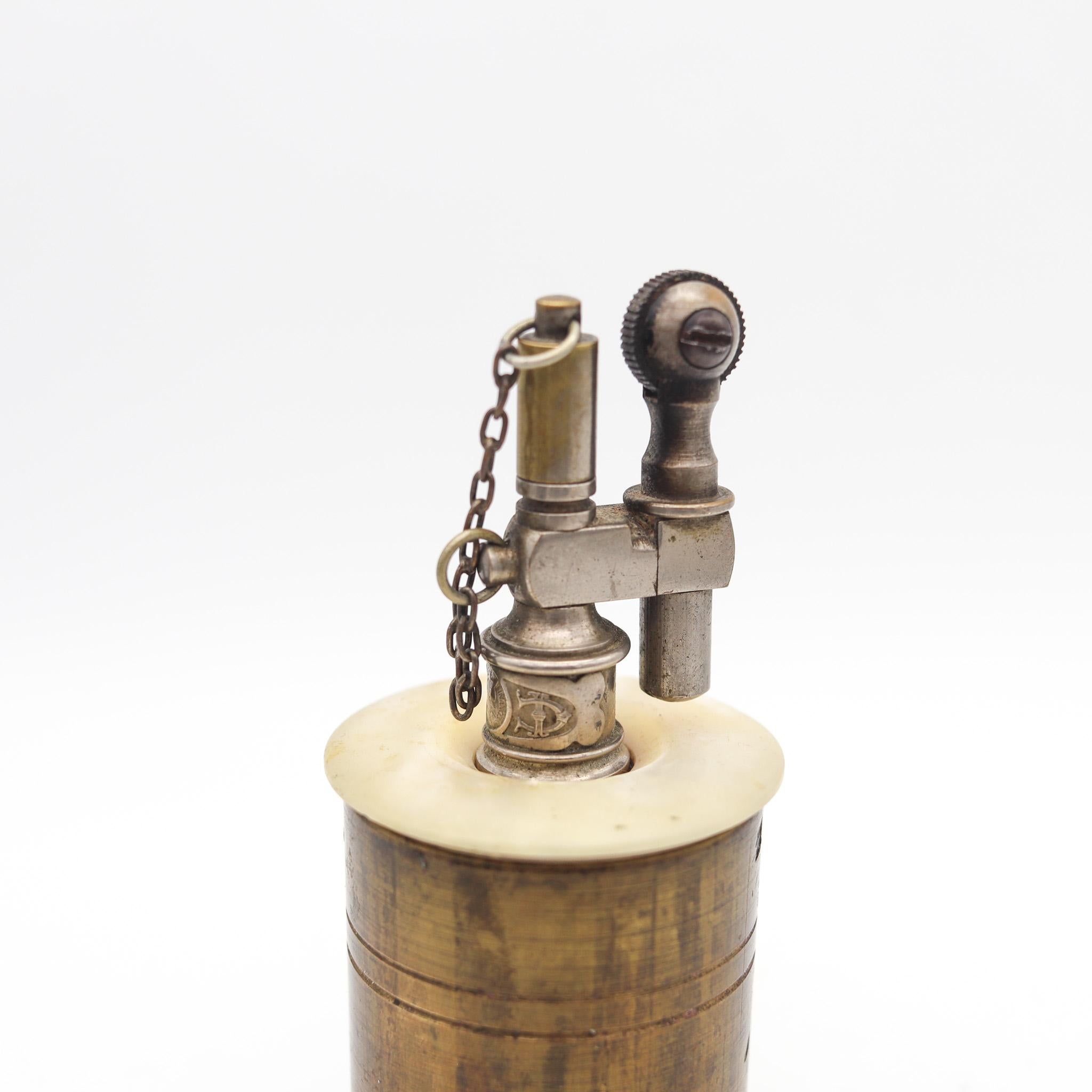 Table petrol lighter designed by Tiffany & Co.

Beautiful and unusual antique table petrol lighter, created in Paris France by the Tiffany & Co., back in the 1919. Crafted after the WWI as a trench-art piece in solid brass with high polished finish