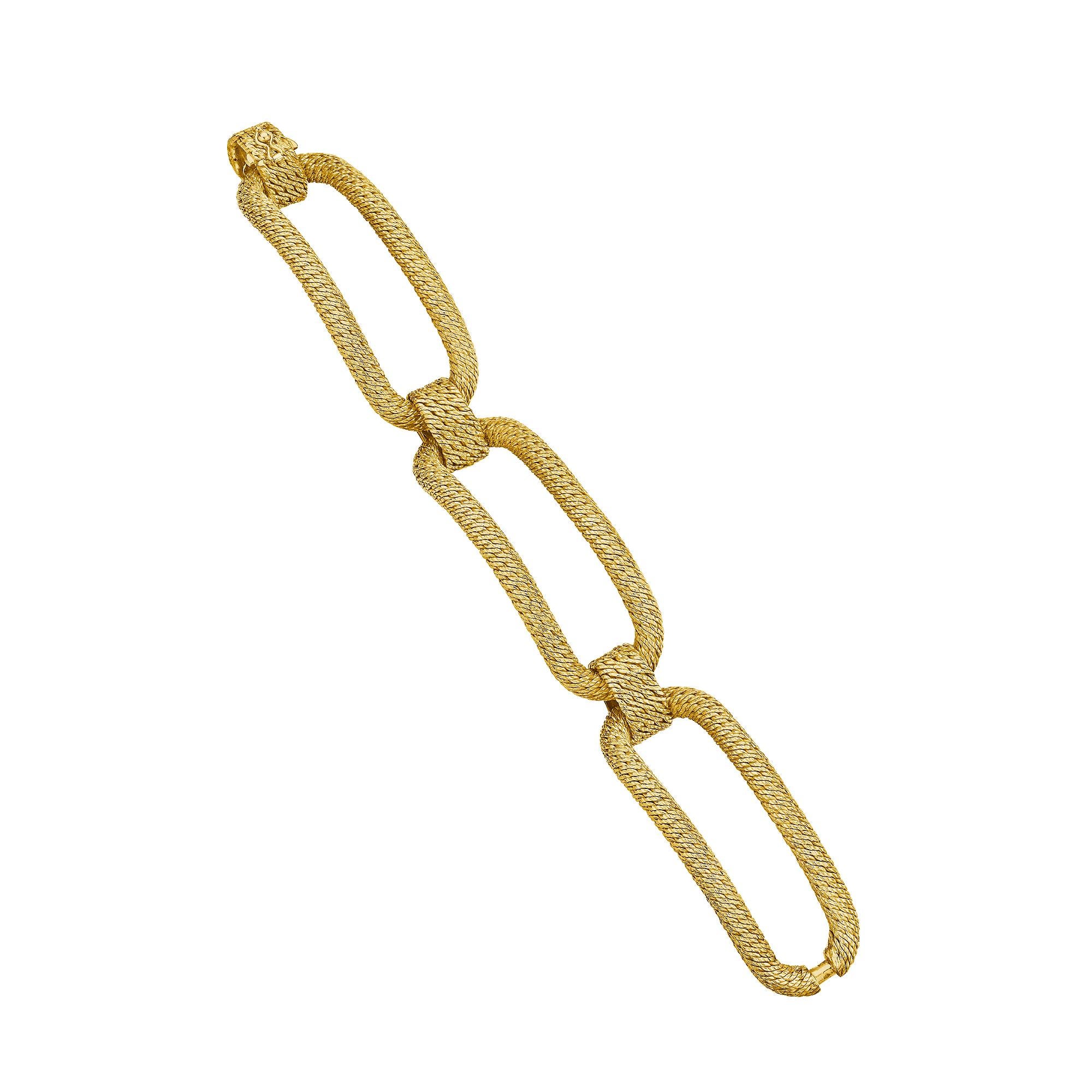 Appearing as though it was woven from spun gold, this Tiffany & Co. Paris George L'Enfant modernist textured long link bracelet is simply sublime.  The three elongated mesh patterned links are designed to comfortably hug your wrist with a graceful