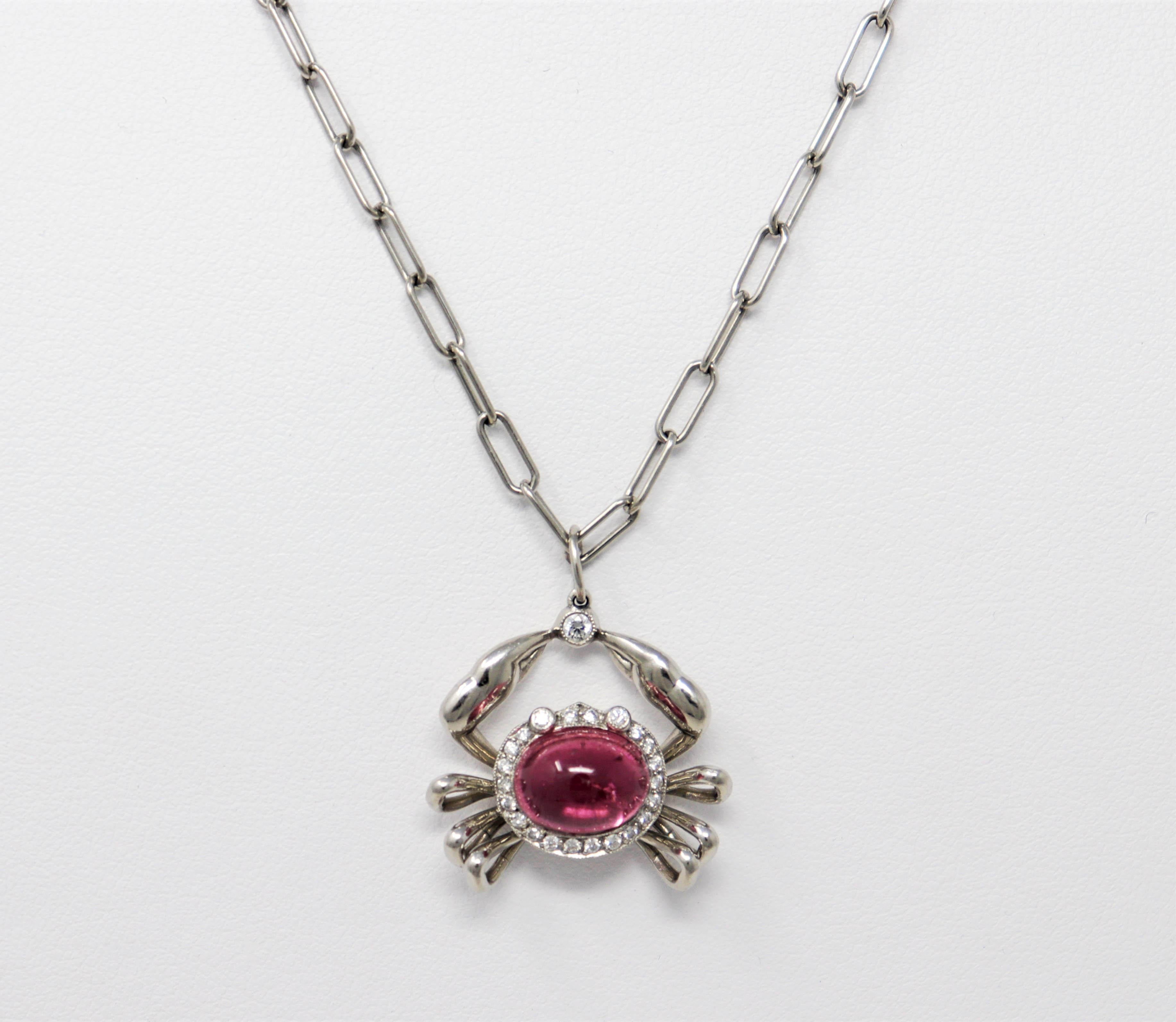 Charming and unique diamond and tourmaline crab pendant necklace from Tiffany & Co.. This modernized zodiac Cancer / crab motif is embellished with glittering Tiffany diamonds and a single cabochon pink tourmaline stone at the center, while the fine