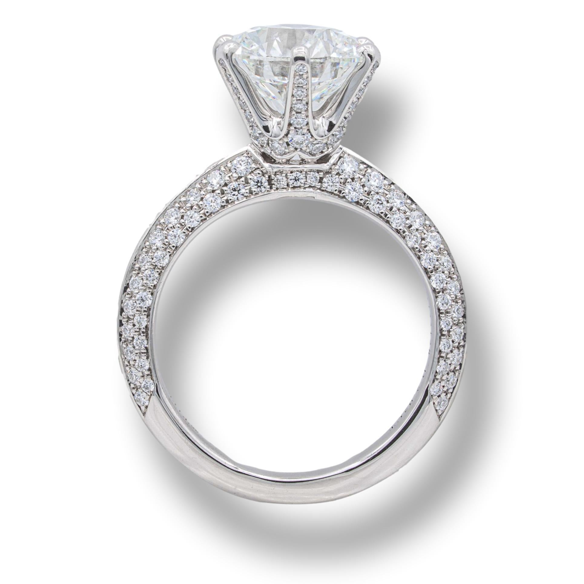Tiffany & Co. Engagement ring from the pave setting collection finely crafted in platinum featuring a round brilliant cut center triple excellent 2.02 ct H color VVS2 clarity with a knife edge design shank set with 2 rows of micro pave diamonds on