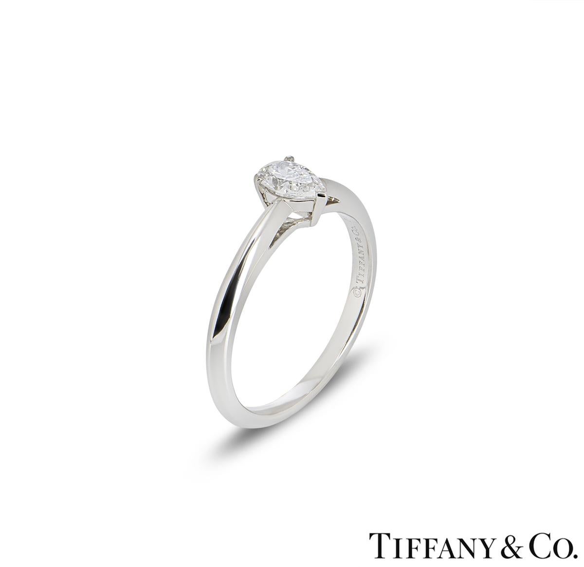 A beautiful platinum diamond ring by Tiffany & Co. The ring comprises of a pear cut diamond in a 3 claw setting with a weight of 0.41ct, E colour and VVS1 clarity. The ring is a size UK N½ - EU 53 - US 7 but can be adjusted for a perfect fit and has