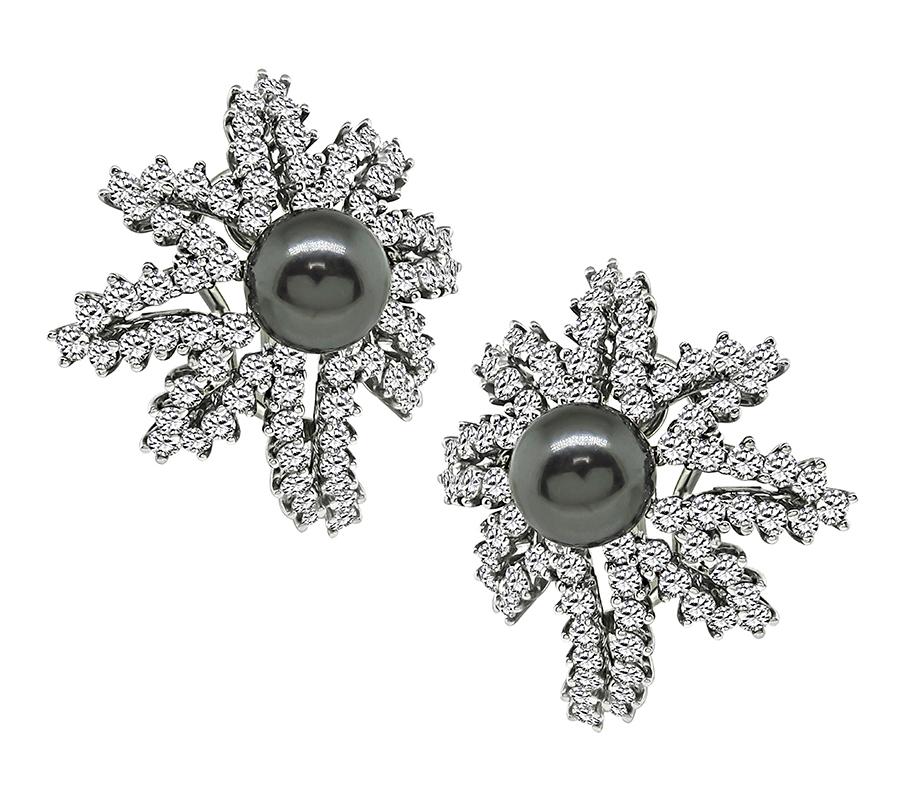 This is a stunning pair of platinum fireworks earrings by Tiffany & Co. The earrings feature sparkling round cut diamonds that weigh approximately 4.00ct+. The color of these diamonds is E with VVS clarity. The diamonds are accentuated by lovely