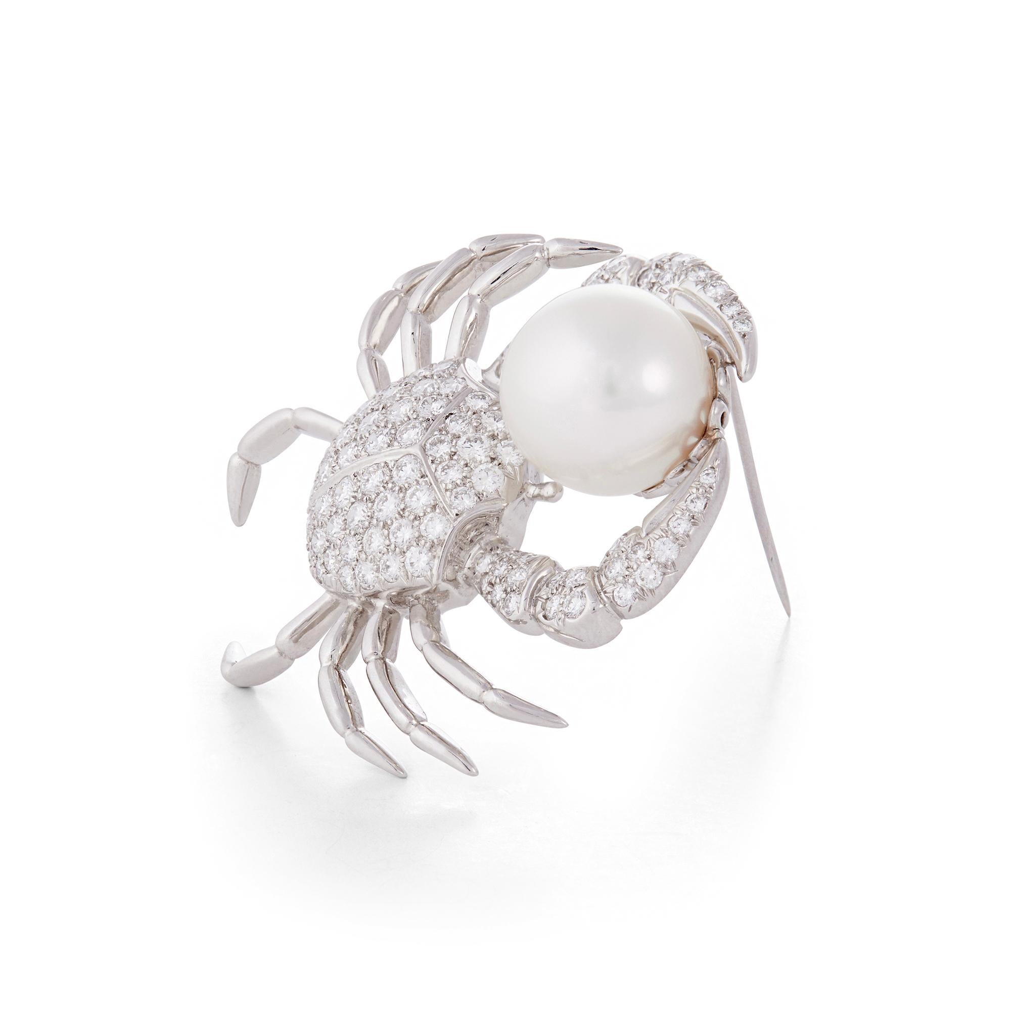 Authentic Tiffany & Co. brooch crafted in platinum to resemble a crab. The body is pave-set with high-quality round brilliant cut diamonds weighing an estimated 2.7 carats, and it is enhanced by a white cultured pearl with a diameter of around 14.3