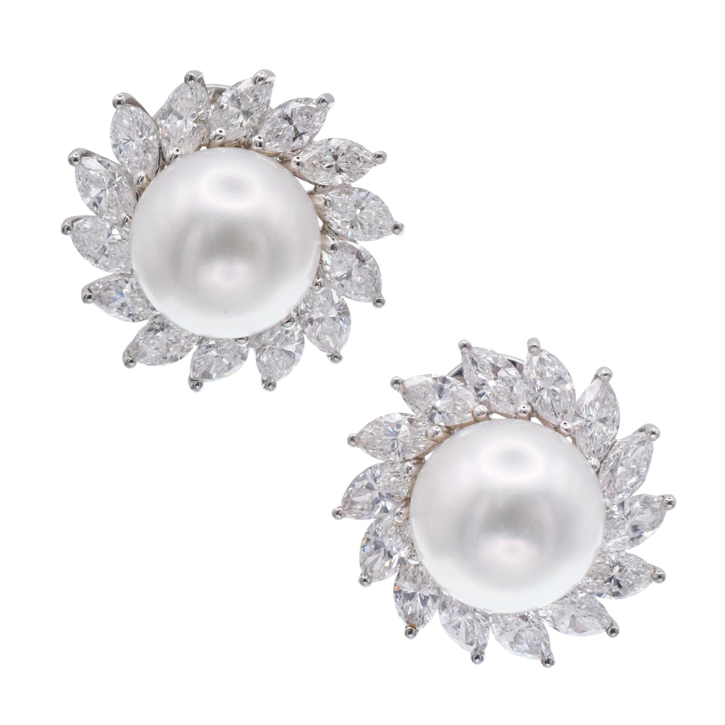 Tiffany & Co. Pearl &  Diamond Ear Clip
Earrings In Platinum. Center of the earrings set with two 11.9mm cultured south sea.pearls, surrounded by
halos of slanted marquise cut diamonds. There is
total of 28 marquise cut diamonds with
total weight of