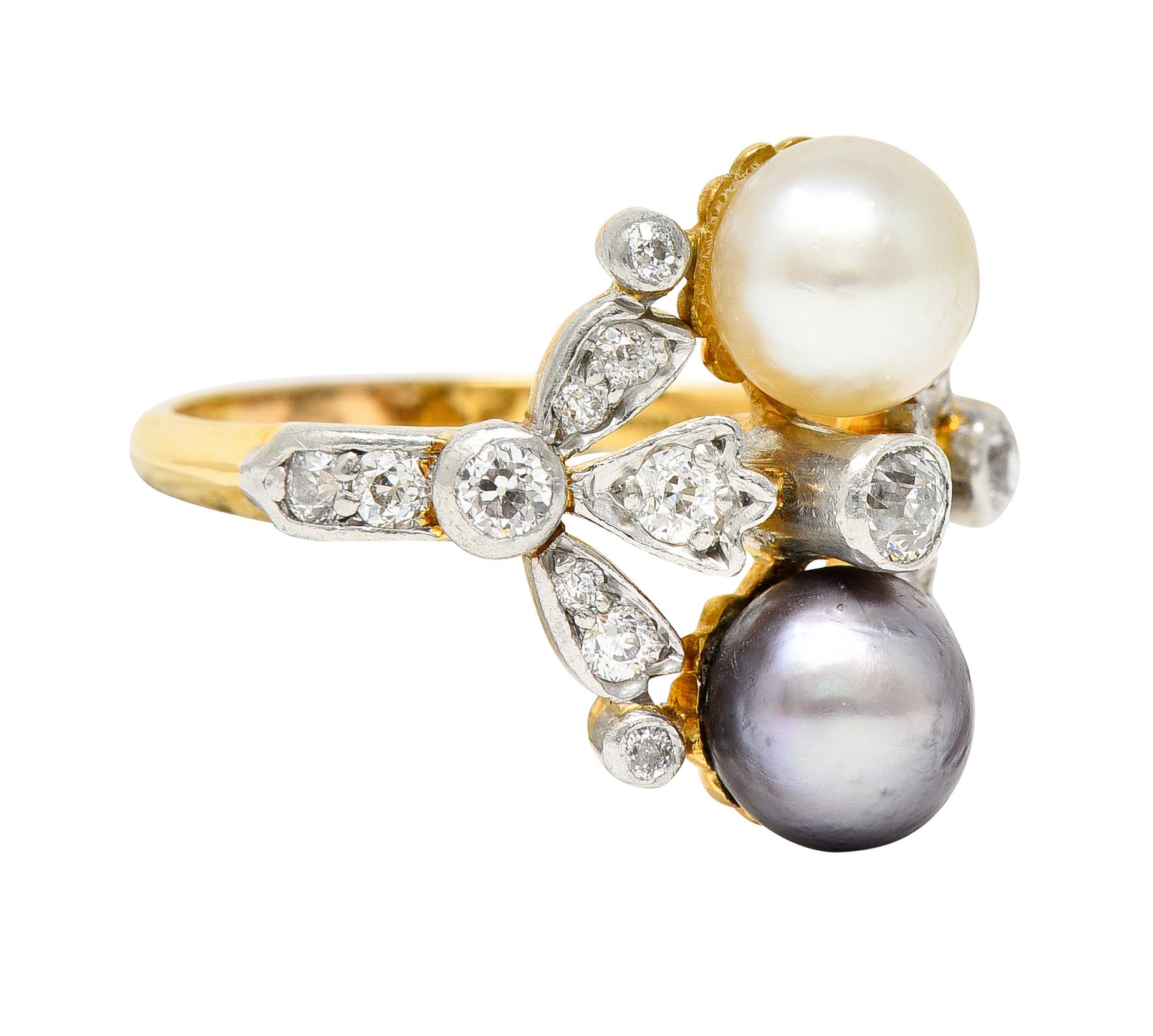 Ring is designed as a stylized floral motif with two 6.5 mm pearls

One is cream in body color while opposing is gray with strong iridescence - both very good in luster

Bezel and bead set throughout by old European and old mine cut
