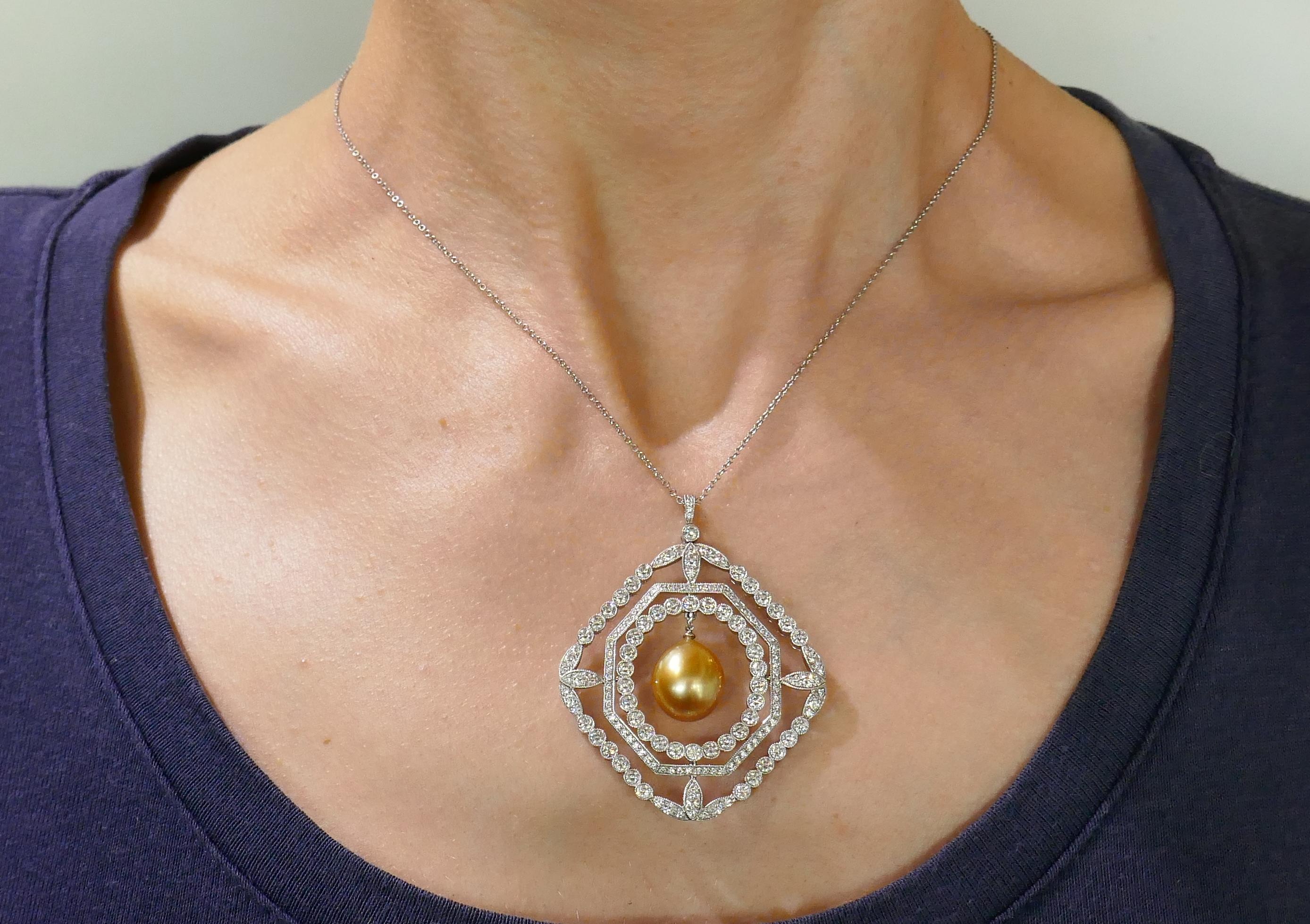 Fabulous pendant necklace created by Tiffany & Co. in the 1990s. Delicate, feminine and wearable, The necklace is a great addition to your jewelry collection. 
The pendant features a gorgeous tear-drop shape South Sea golden pearl intricately framed