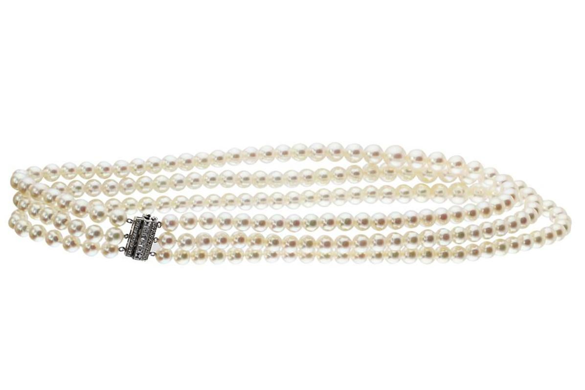 Estate Tiffany & Co. Pearl Necklace. Three strands of 6mm-9mm graduated cultured pearls in a necklace of 18k white gold with a diamond clasp stamped 