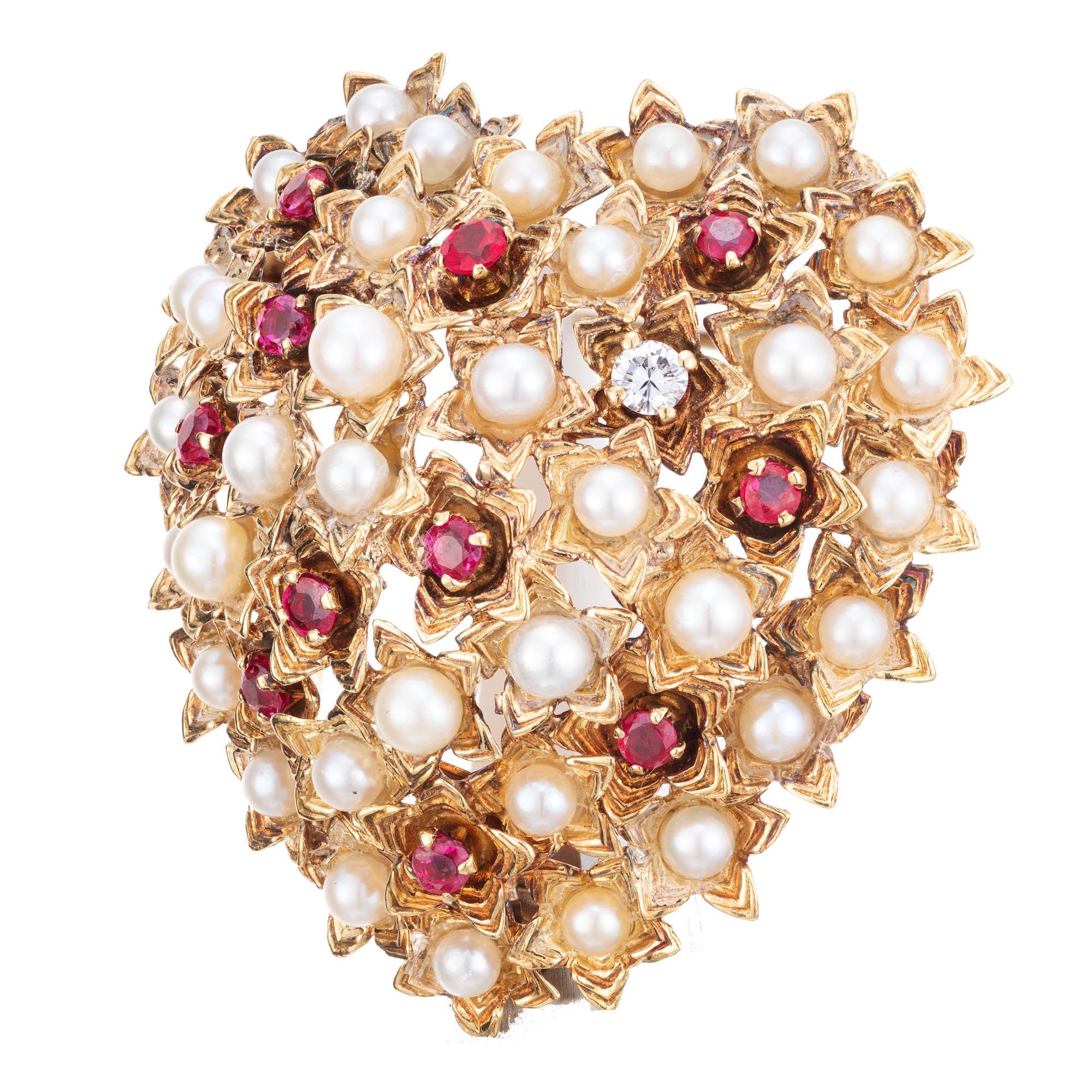 1950's Authentic Tiffany + Co, Ruby, diamond and Akoya pearls set in 18k yellow gold, Italian made domed heart shaped brooch.  

1 round diamond approx. weight .07cts. 
11 round rubies approx. total weight 1.65cts
35 round Akoya pearls 1 1/2 by 1