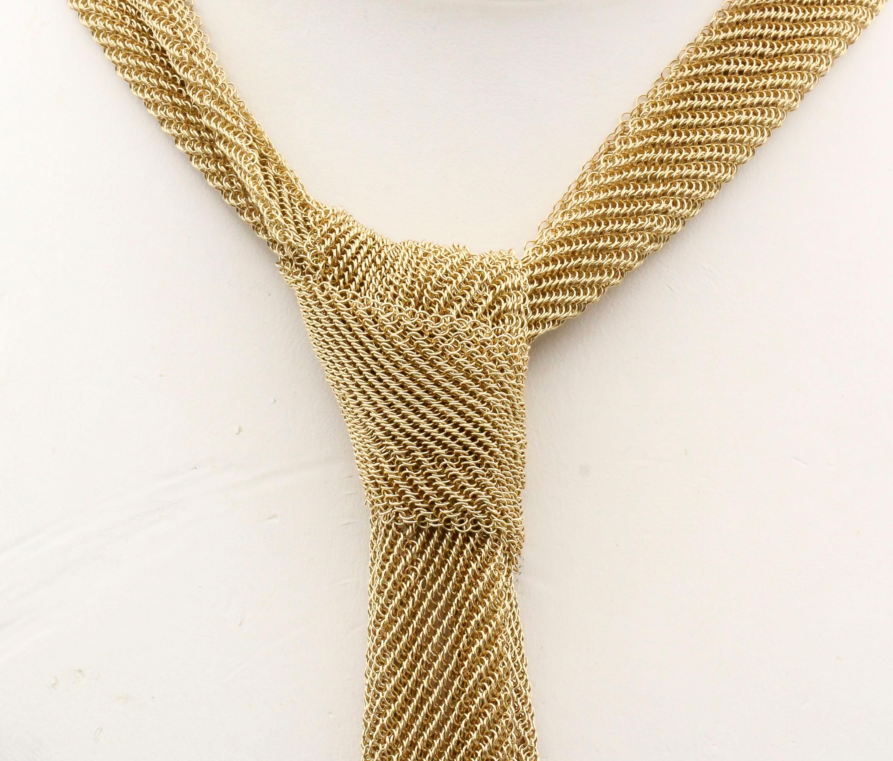 Chic and interesting mesh 18K yellow gold scarf necklace by Tiffany & Co. Peretti. Intricate mesh design, very light and delicate. Can be used in a number of way, even as a chic skinny tie as shown in one of the pictures.  This is the smaller of the
