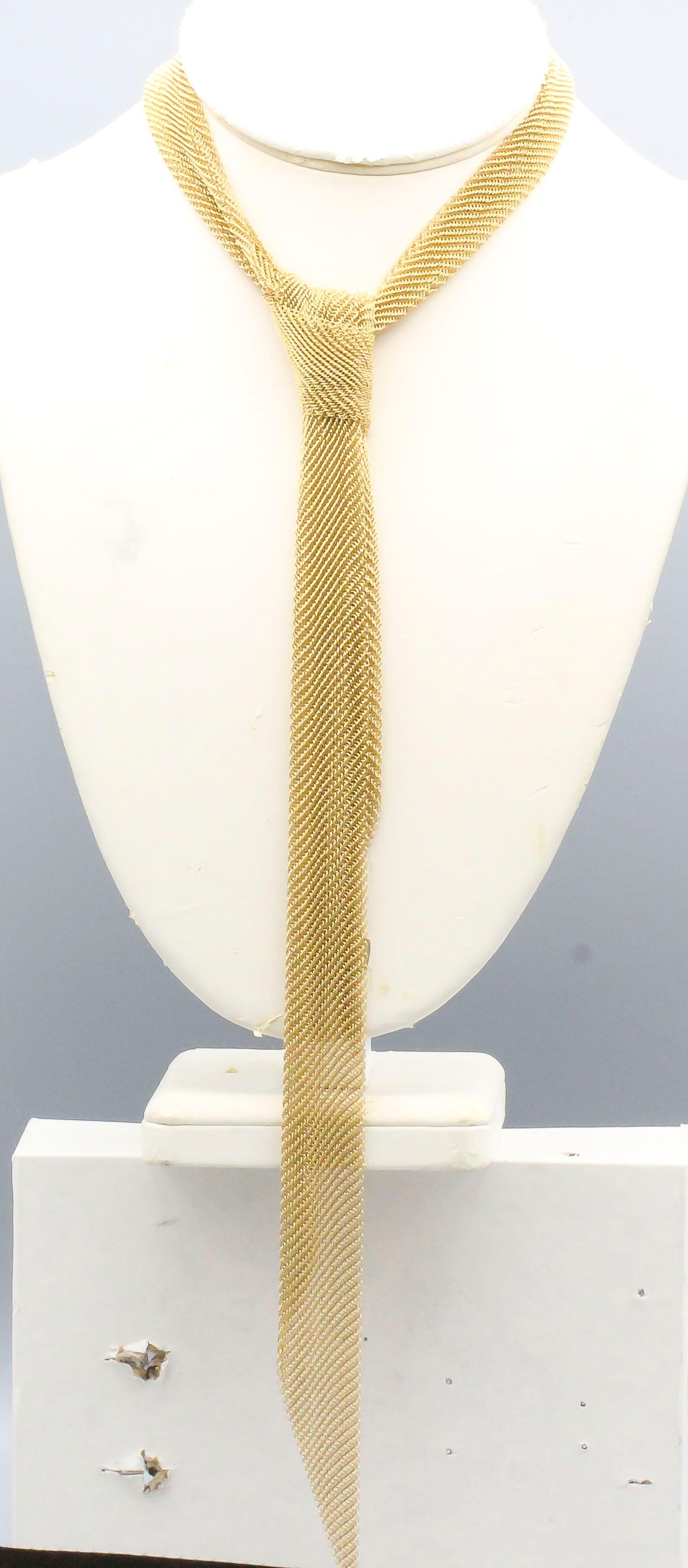 Chic and interesting mesh 18K yellow gold scarf necklace by Tiffany & Co. Peretti. Intricate mesh design, very light and delicate. Can be used in a number of way, even as a chic skinny tie as shown in one of the pictures.  This is the smaller of the