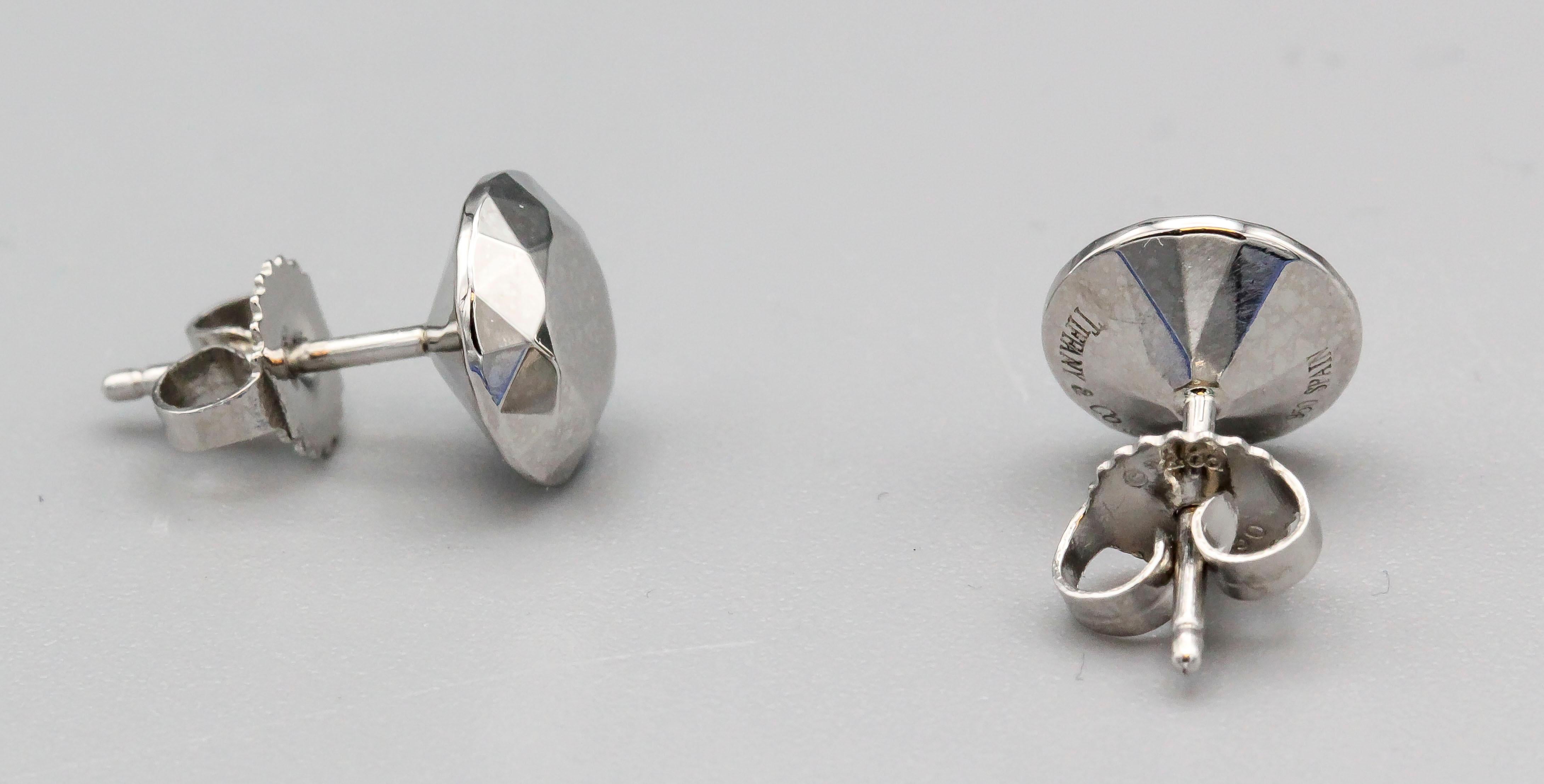 Fine platinum earrings by Tiffany & Co Elsa Peretti. Designed in the likeness of  a 2 carat diamond, these chic earrings are versatile, attractive, and reasonably priced.

Hallmarks: Tiffany & Co., Peretti, PT950, Spain.