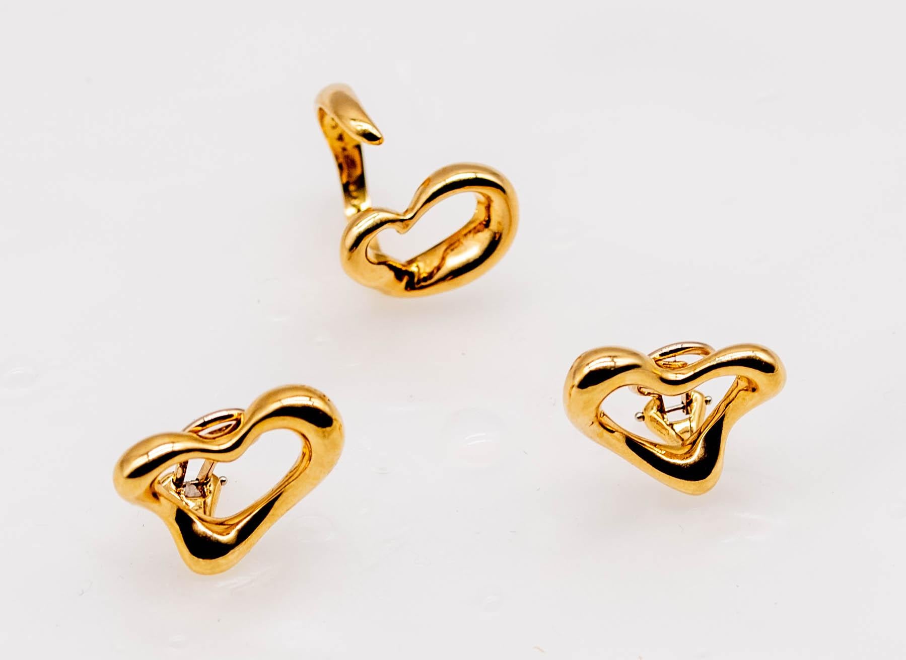 Typically Tiffany from the 70's and 80's, this fresh interpretation of the heart shape bears the classic Elsa Peretti sense of Italian style and taste.  Open heart motifs are constructed of, sinuous irregular blobs of gold that add a sensual appeal