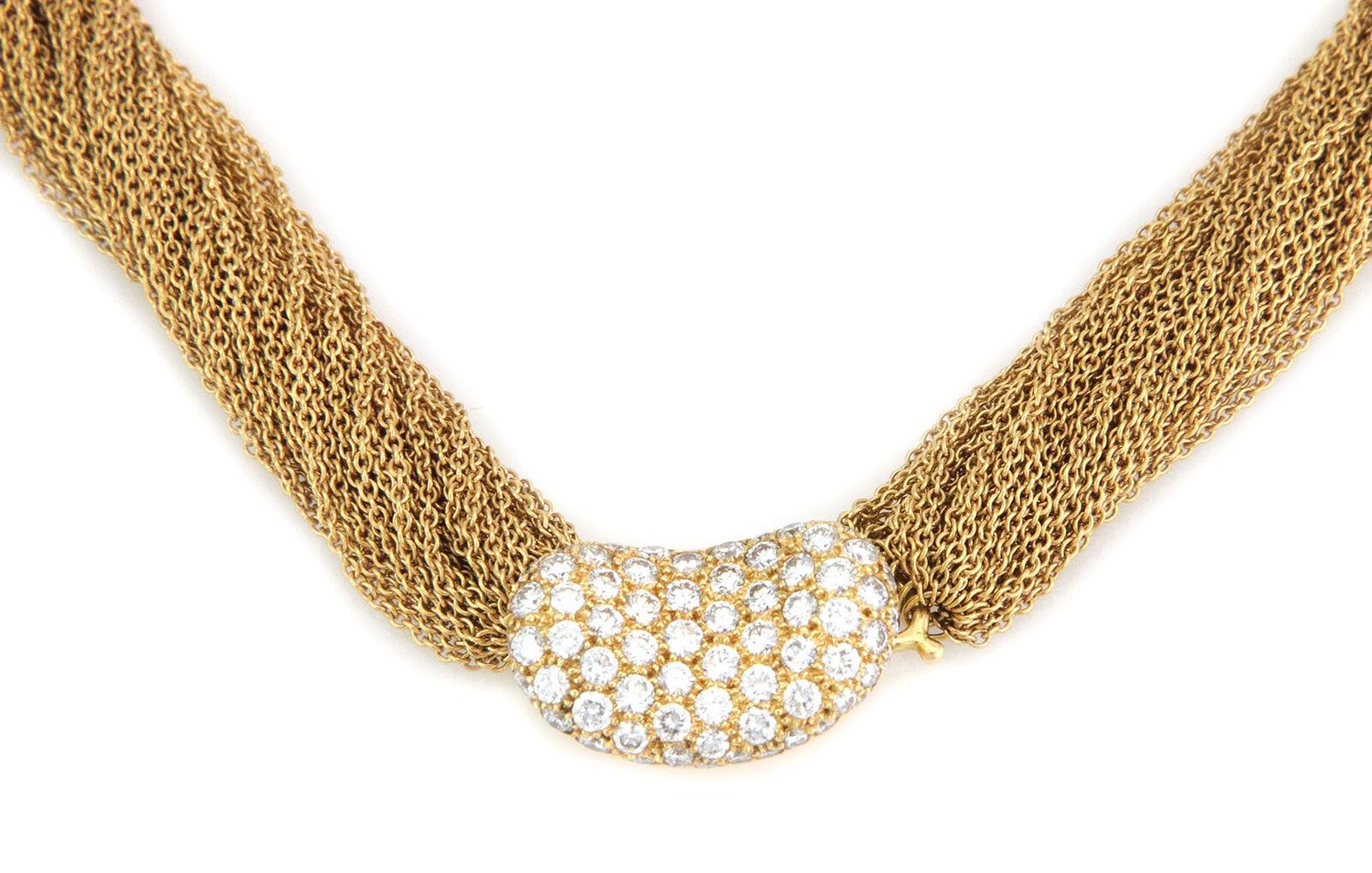 Von der Designerin Elsa Peretti ist ihre Bean Collection, diese authentische Halskette ist von Tiffany & Co. Gefertigt aus 18 Karat Gelbgold mit einer mehrsträngigen Kette mit flüssigem, weichem Griff. Am Ende der Stränge befindet sich eine