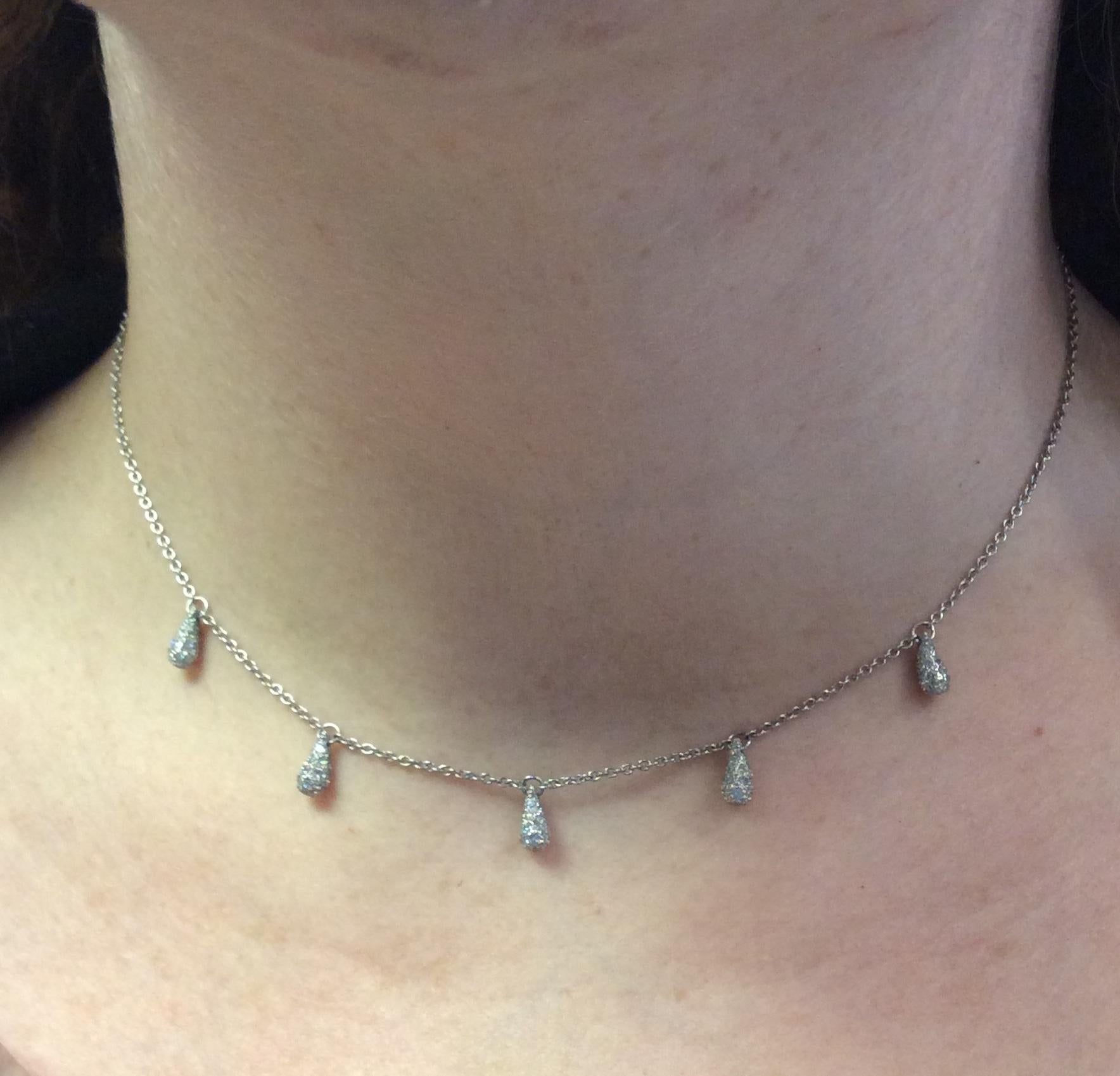 Delicate and feminine platinum  and diamond drop necklace. Made by Elsa Peretti for Tiffany & Co.  Signed by both. Suspending five diamond encrusted teardrops.  16