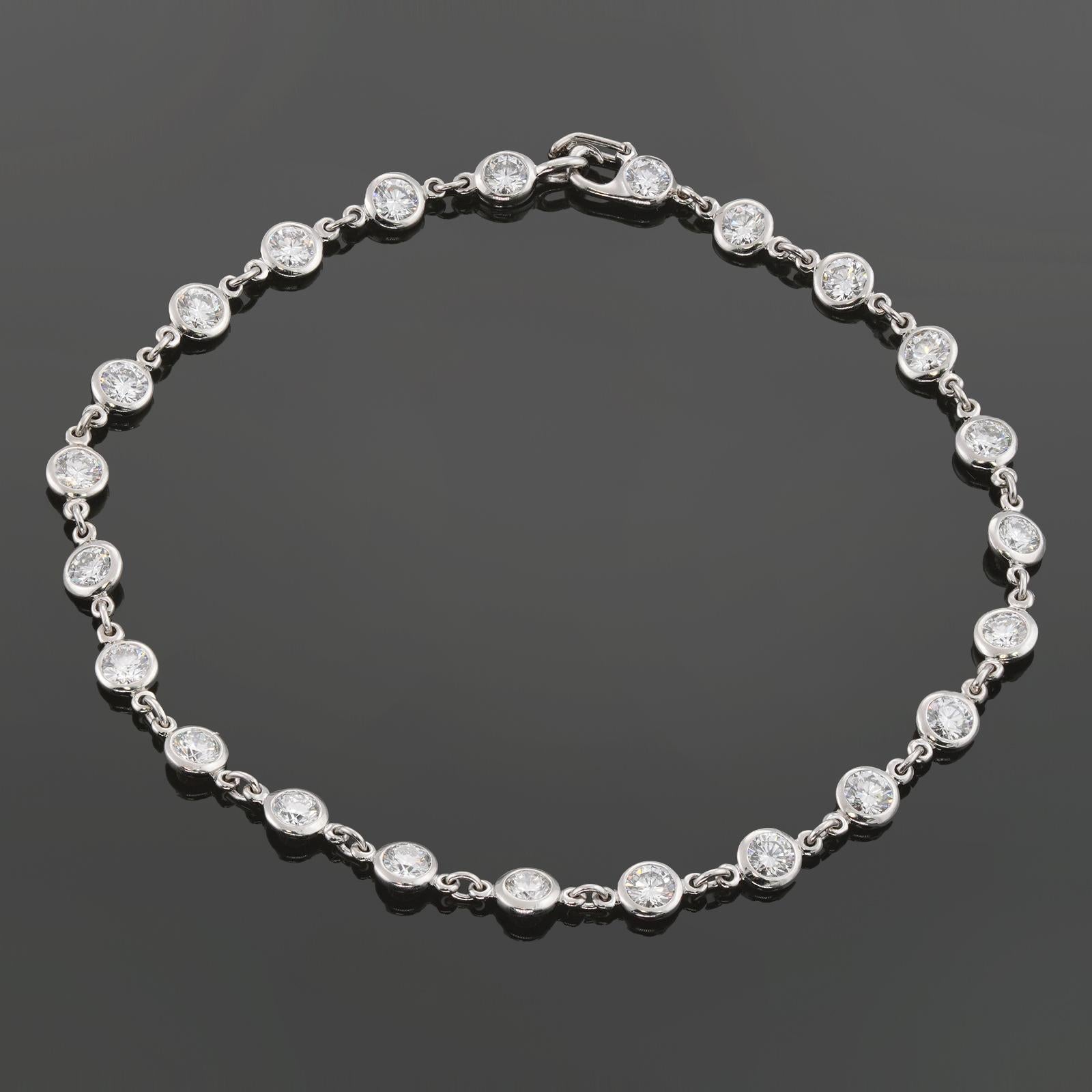 This exquisite Tiffany & Co. Diamond by the Yard bracelet is crafted in platinum and bezel-set with 23 brilliant-cut round E-F-G VVS1-VVS2 diamonds weighing an estimated 2.30 carats. Made in United States circa 2024. Measurements: 0.15