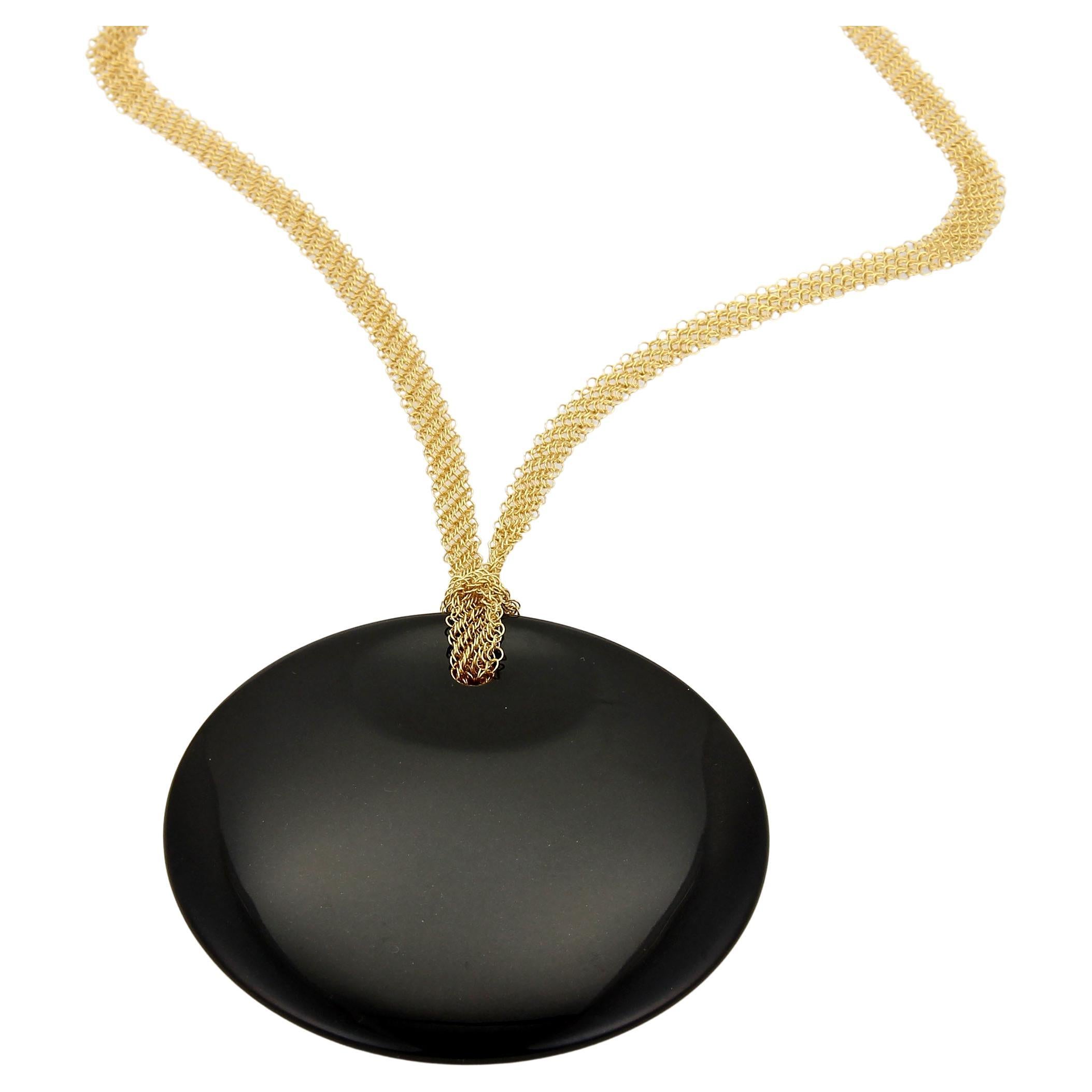 This is a gorgeous authentic pendant and mesh chain necklace from Tiffany & Co. by designer Elsa Peretti from her Round  collection, the pendant is crafted from black jade in the style of a large concave disc shape, it comes with a 5.5mm wide mesh
