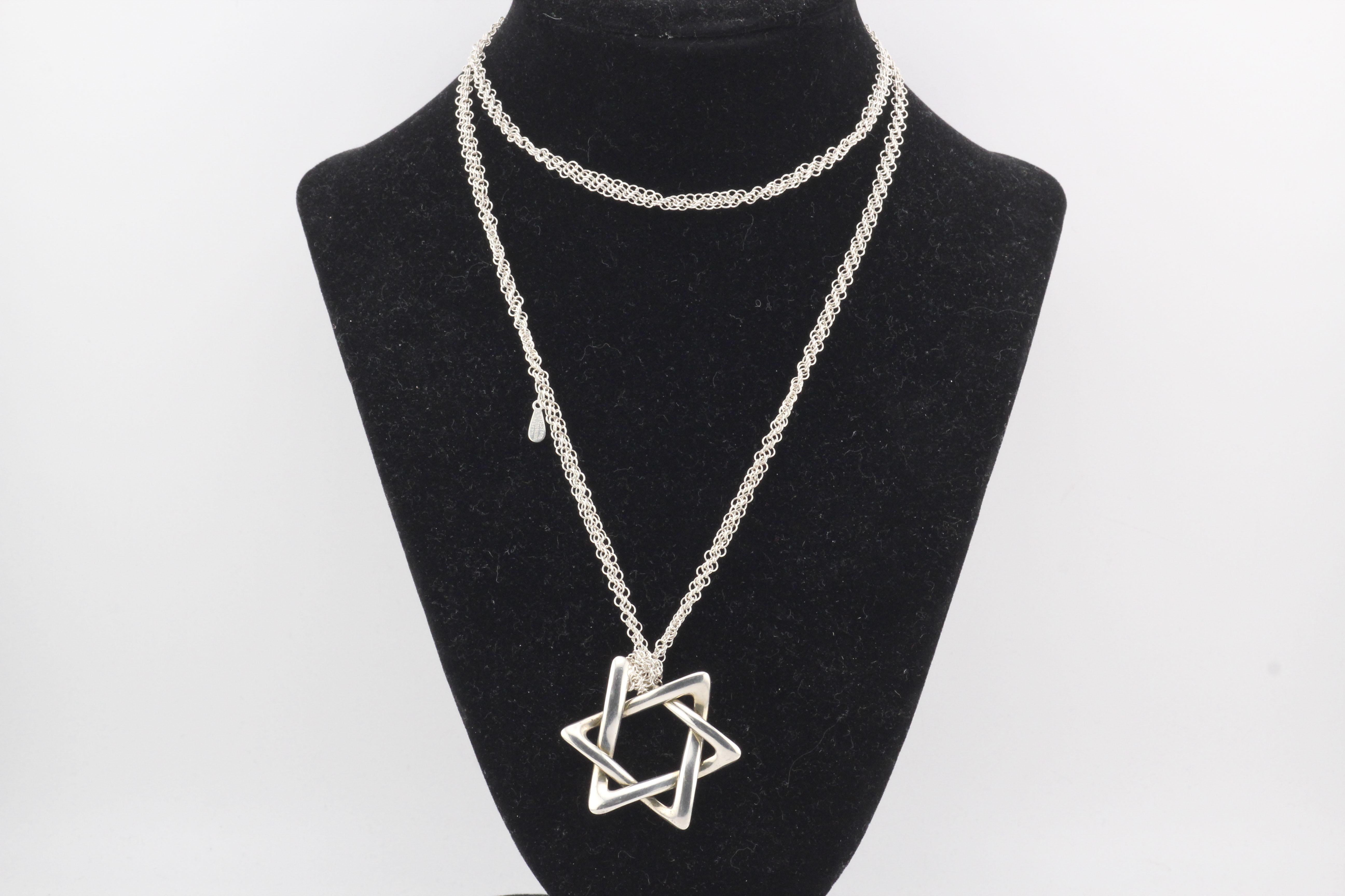 The Tiffany & Co. Peretti Extra Large Star of David Pendant is a striking and elegant expression of faith, crafted with Elsa Peretti’s signature minimalist aesthetic. Made from sterling silver, this bold yet graceful pendant features an extra-large