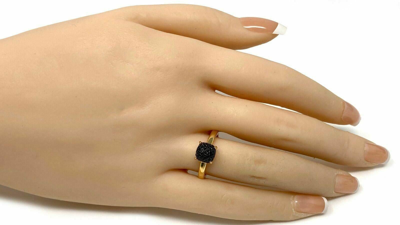 This elegant authentic ring is from Tiffany & Co. by designer Paloma Picasso from her Sugar Stacks collection. It is crafted from 18k rose gold with a polished finish. The ring has a mini cushion shape form with a dome top set with pave black spinel