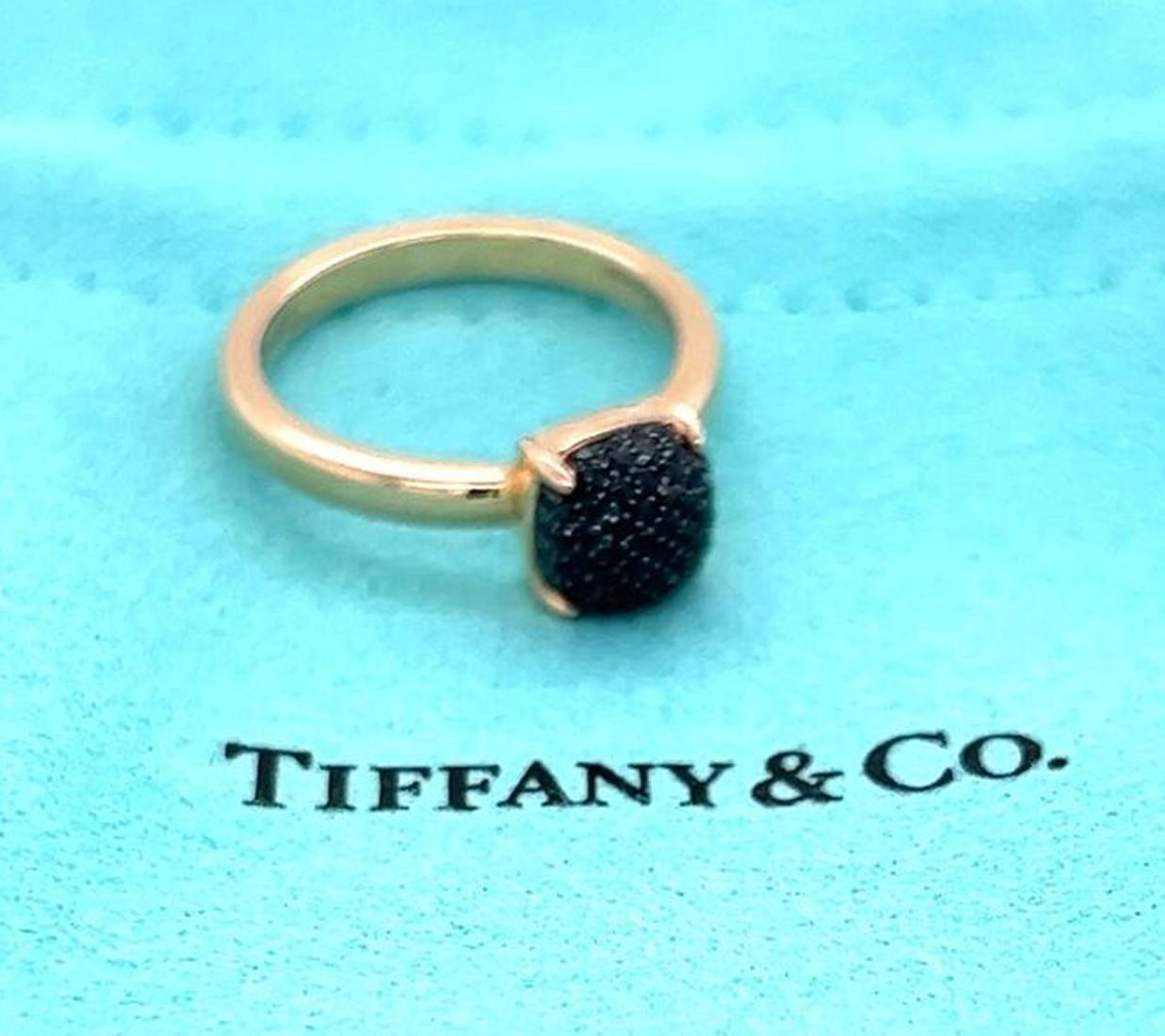 Authentic elegant ring is from Tiffany & Co. by designer Paloma Picasso from her Sugar Stacks collection. It is crafted from 18k rose gold with a polished finish. The ring has a mini cushion shape form with a dome top set with pave black spinel