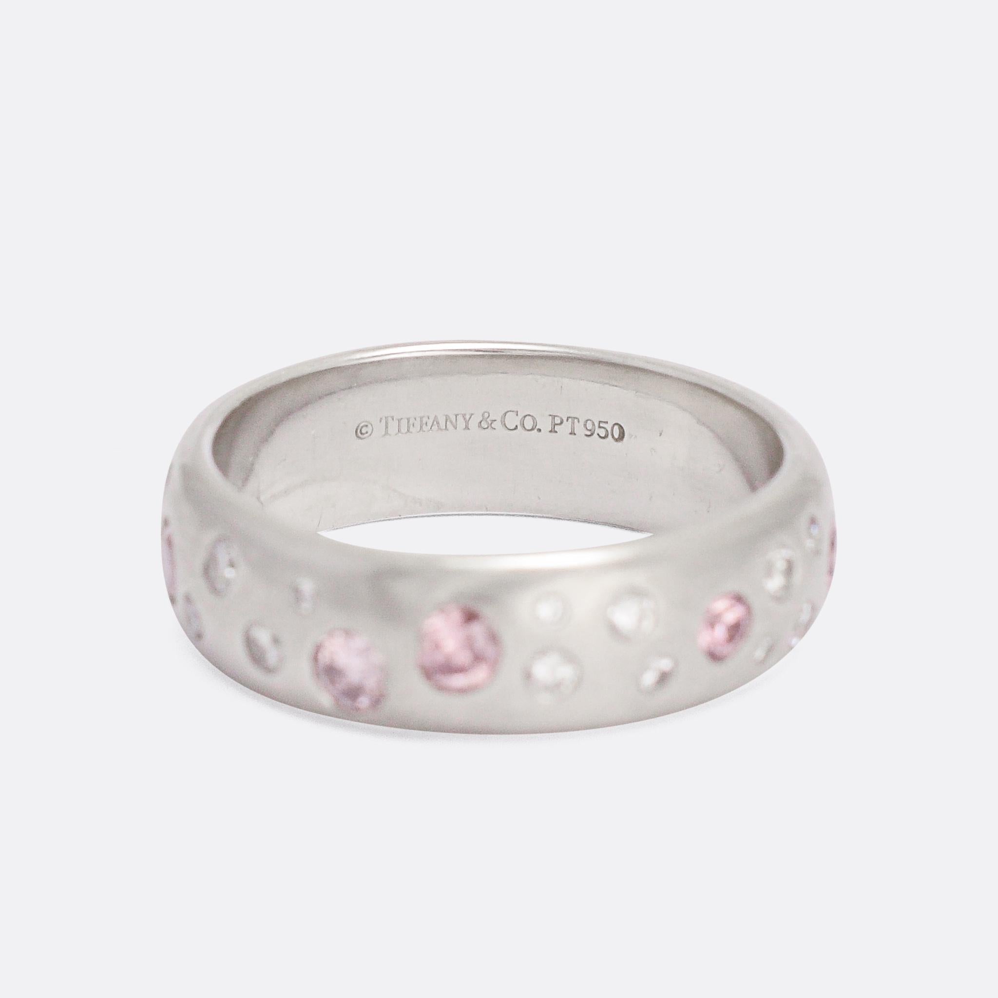 An attractive pink and white diamond band by Tiffany & Co. There's not much age to it, it dates from around the turn of this century, but it's particularly well made - crafted in platinum throughout with a good substantial feel. Set with diamonds of