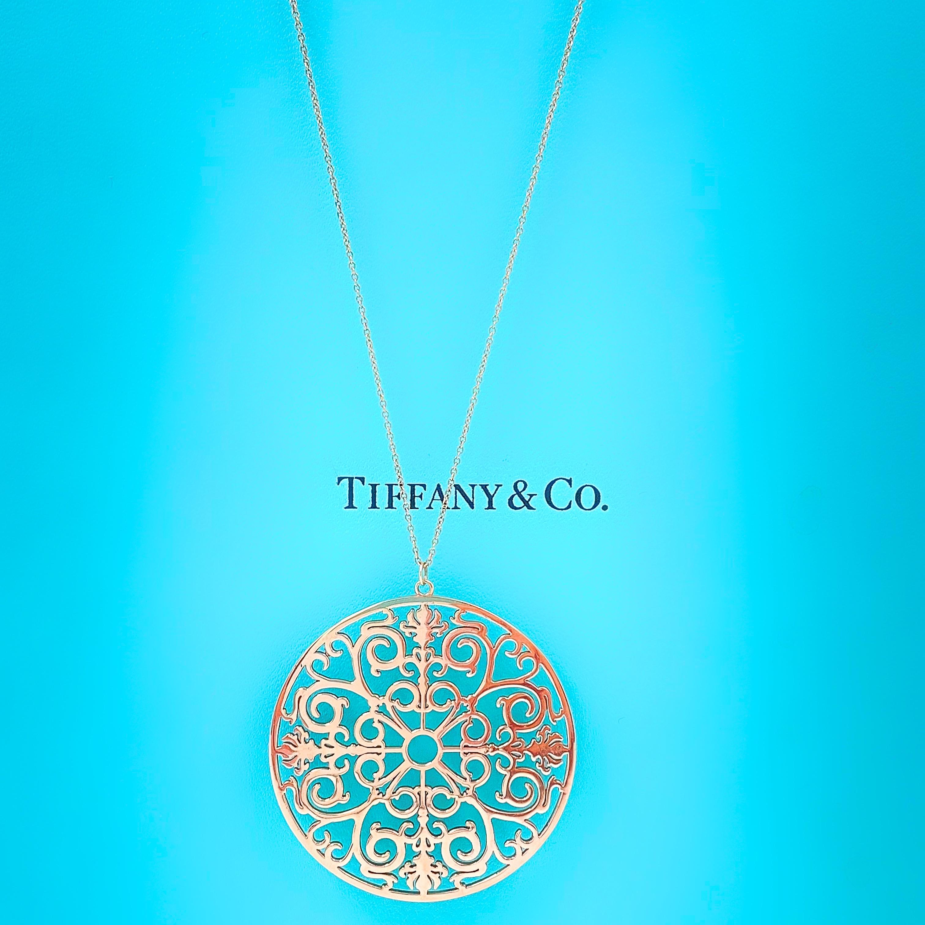 Tiffany & Co Enchant Round Pendant Necklace
Style:  Pendant Necklace
Ref. number:  175 41 31046971
Metal:  Pink Rubedo Metal
Size:  XL -   2 Inches Pendant
Chain Length:  24' Inches
Hallmark:  ©TIFFANY&CO. METAL on Clasp
Includes:  Tiffany & Co