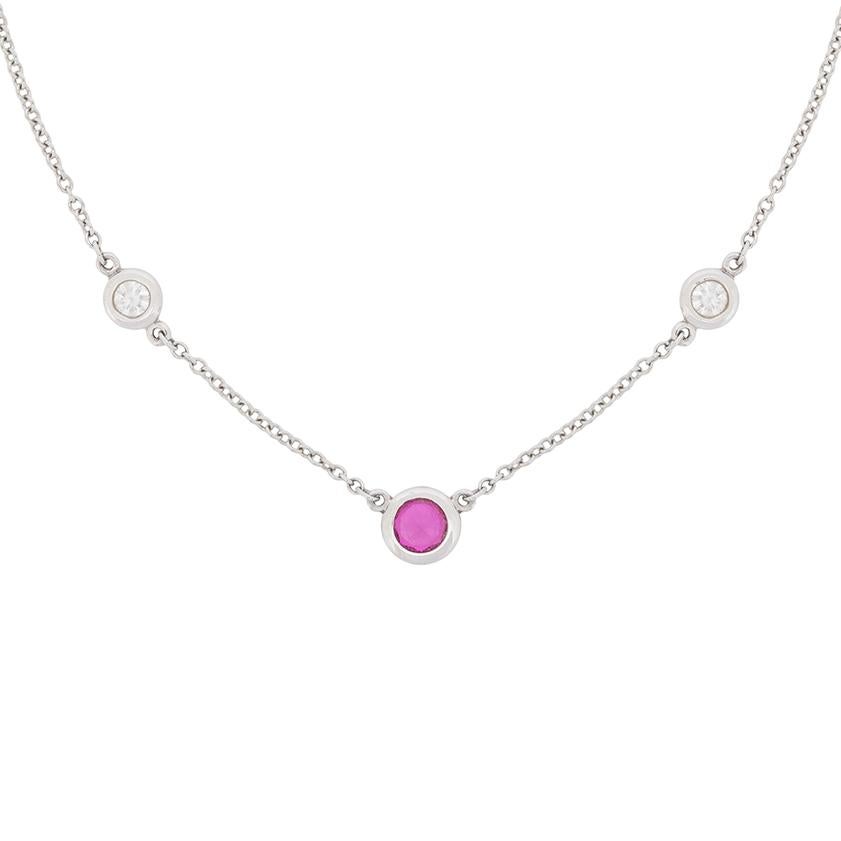 Signed by Tiffany & Co, with original makers mark, this delicate necklace makes for the ideal gift. In the centre, is a rub over set pink sapphire weighing 0.30 carat. It is a wonderful, deep, rich pink and is highlighted expertly by the two diamond