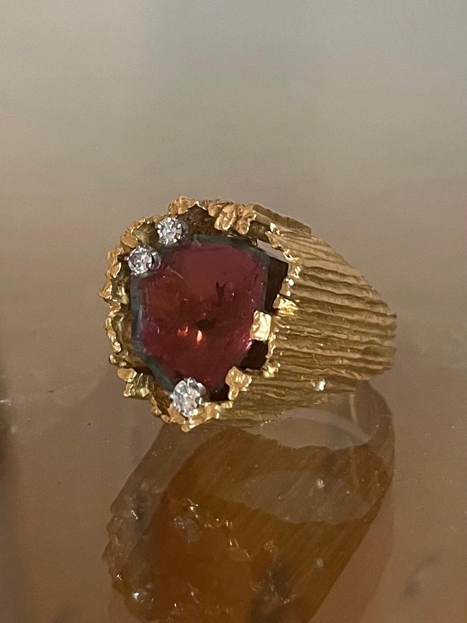 Gorgeous Modernist Ring by Tiffany and Co. Pink Tourmaline with a graphic sculptural 18K Gold setting and small diamonds. Organic and Sculptural,. Probably a collaboration with Andrew Grima  as  Grima’s designs are as naturalistic as they are