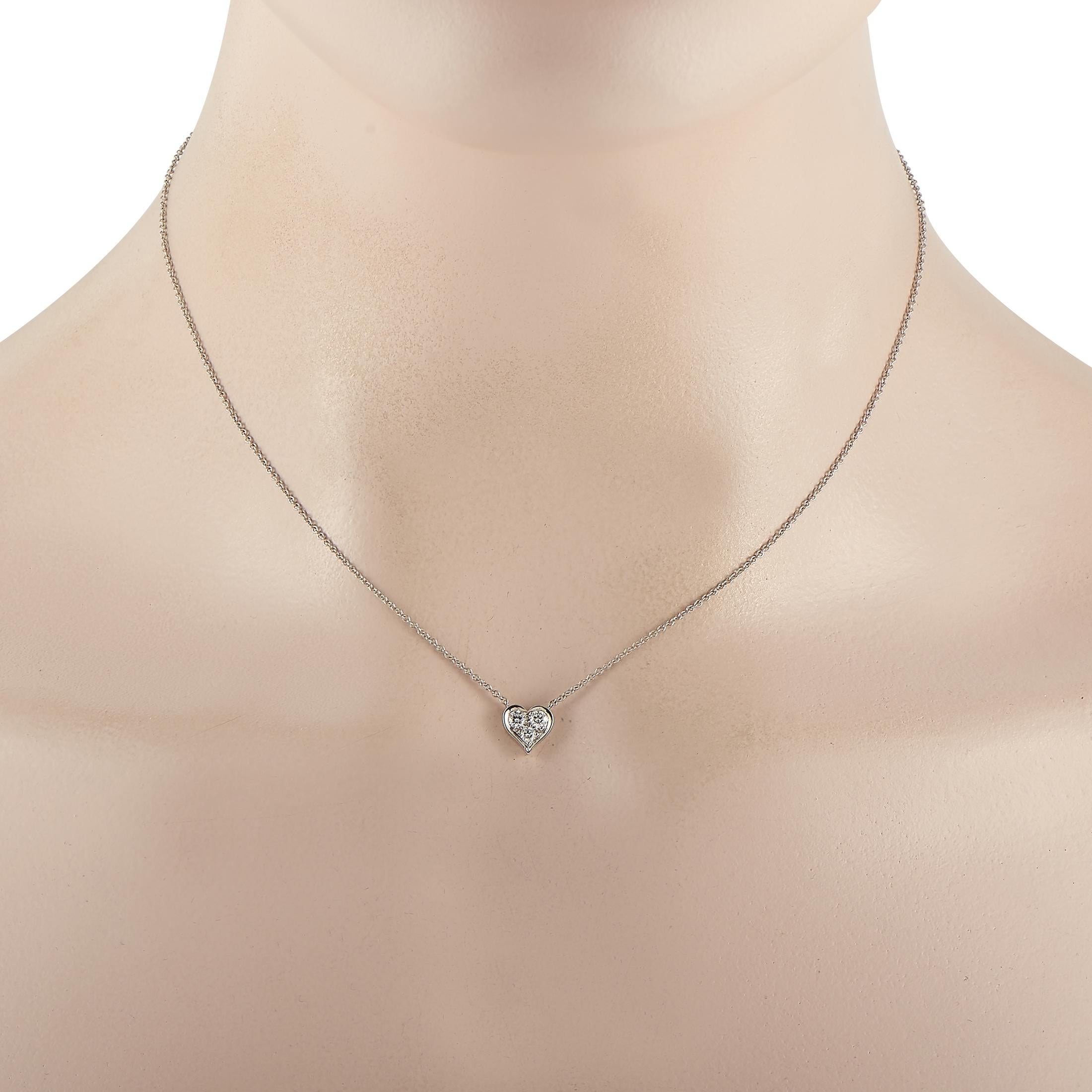 Give your outfits a classy and polished finish with this lovely little jewel. The Tiffany & Co. Platinum 0.17 ct Diamond Heart Necklace features a feminine style with its tiny heart pendant dotted with a cluster of diamonds. A spring ring clasp