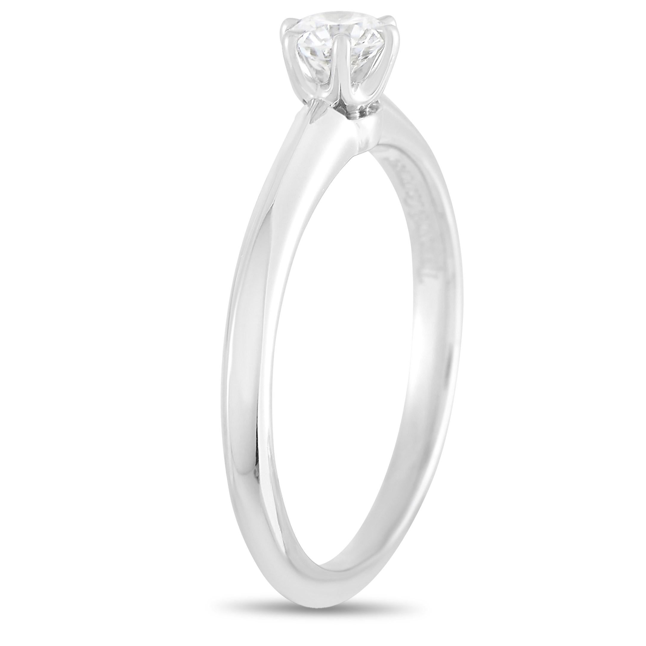 Six prongs, slender knife-edge band, round brilliant diamond - all these point to the iconic beauty of a Tiffany & Co Setting Engagement Ring. This Tiffany & Co. Setting Platinum 0.25 ct Diamond Engagement Ring in particular displays a 0.25-carat